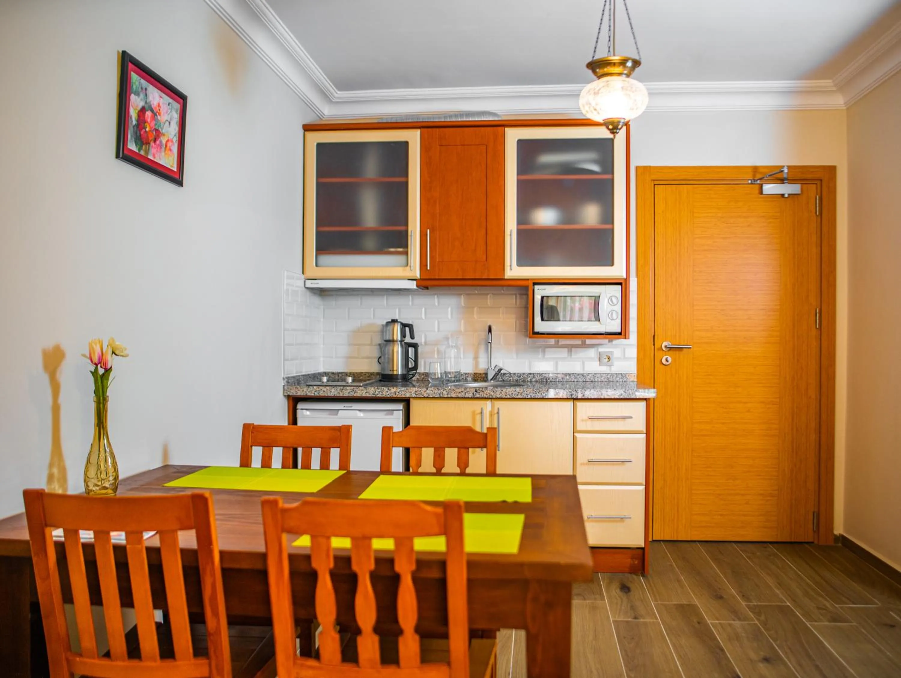 Kitchen or kitchenette in Dores Residence