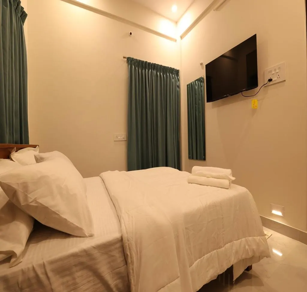 Bed in Olivette Suites