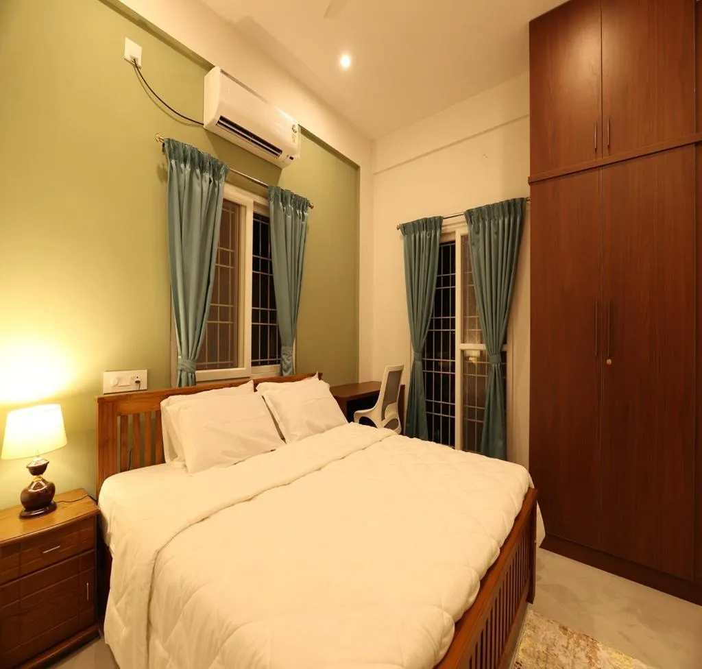 Bed in Olivette Suites