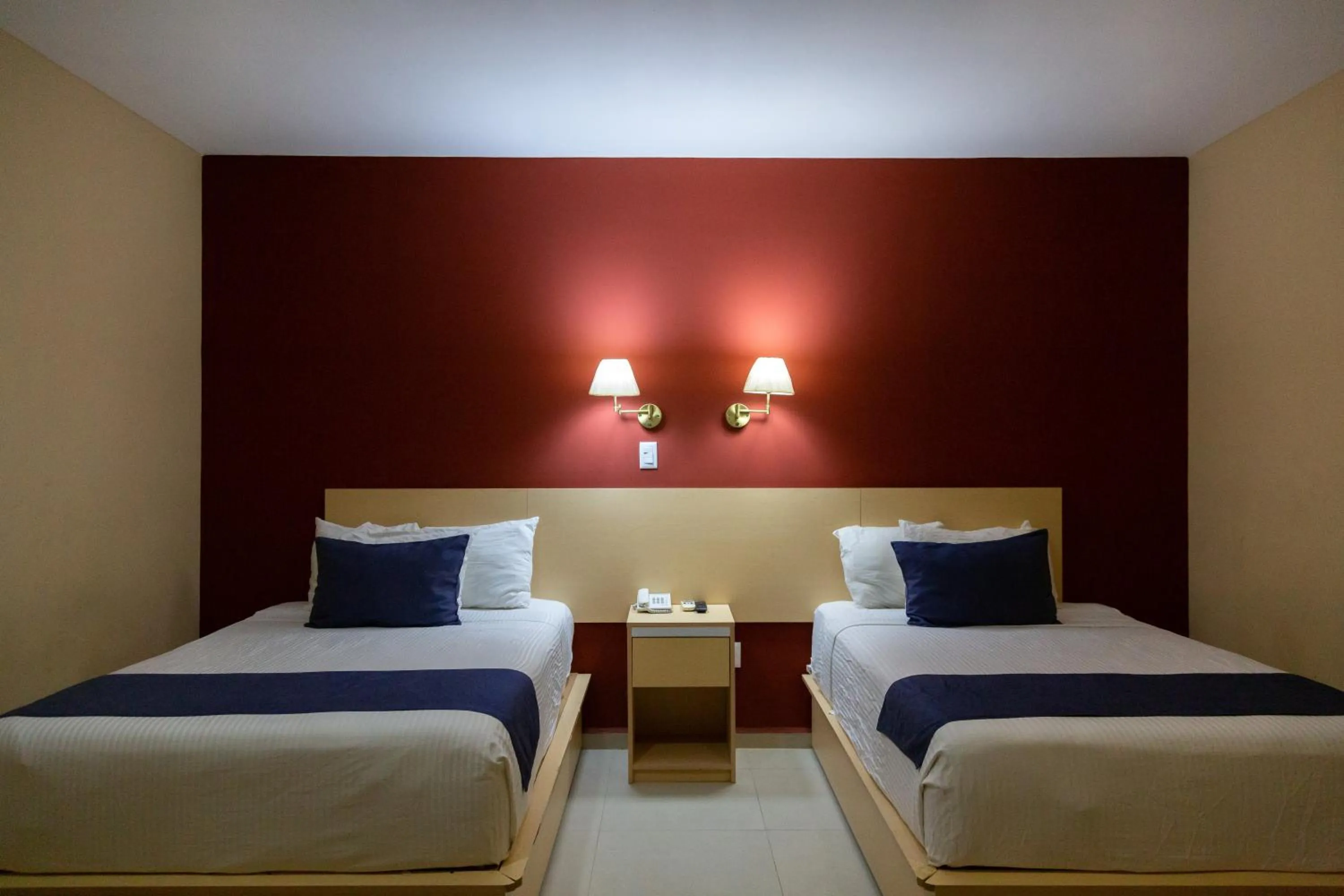 Bed in Sleep Inn Tuxtla