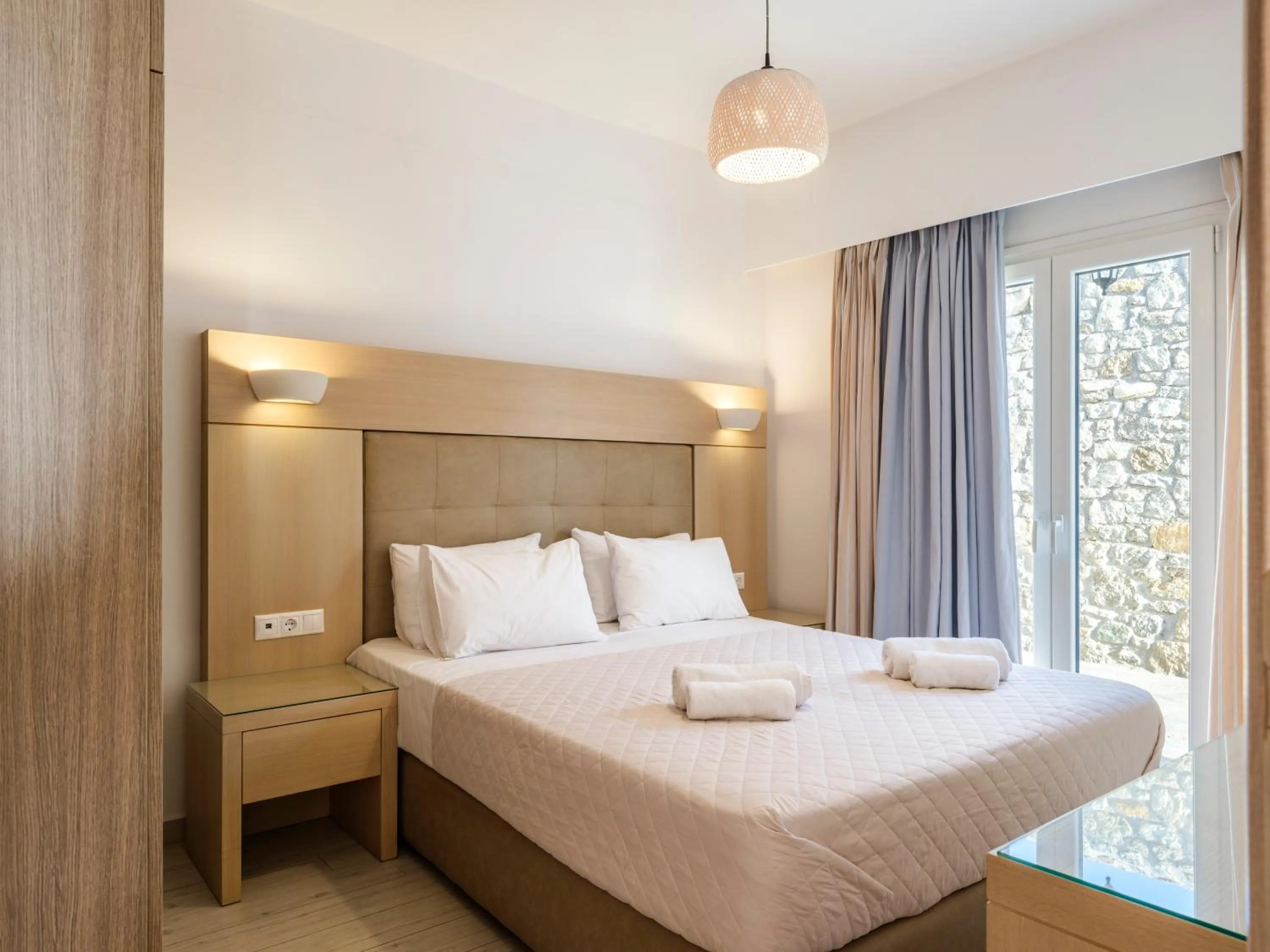 Bed in Evi Suites & Villas