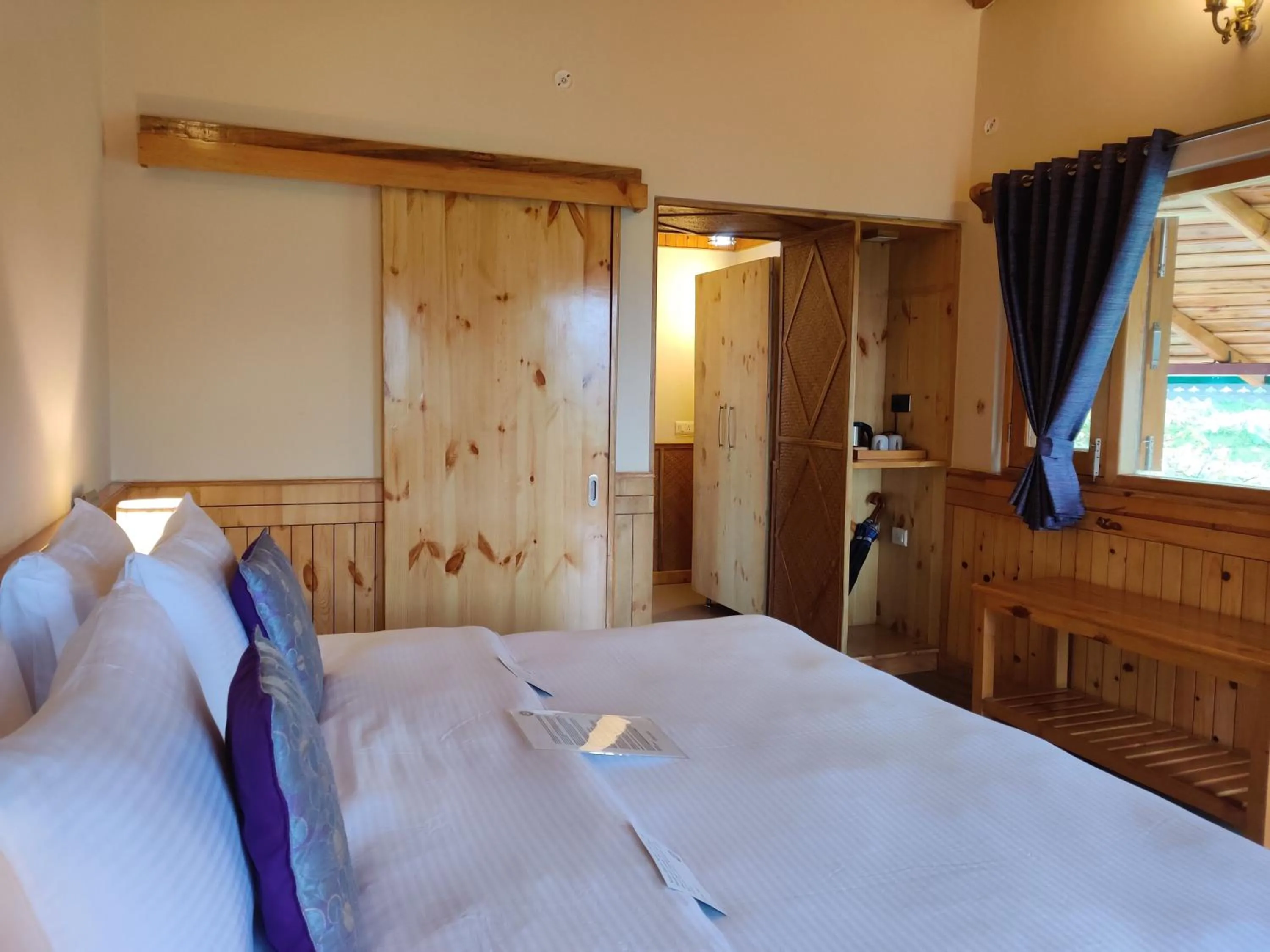 Bed in Parvada Bungalows