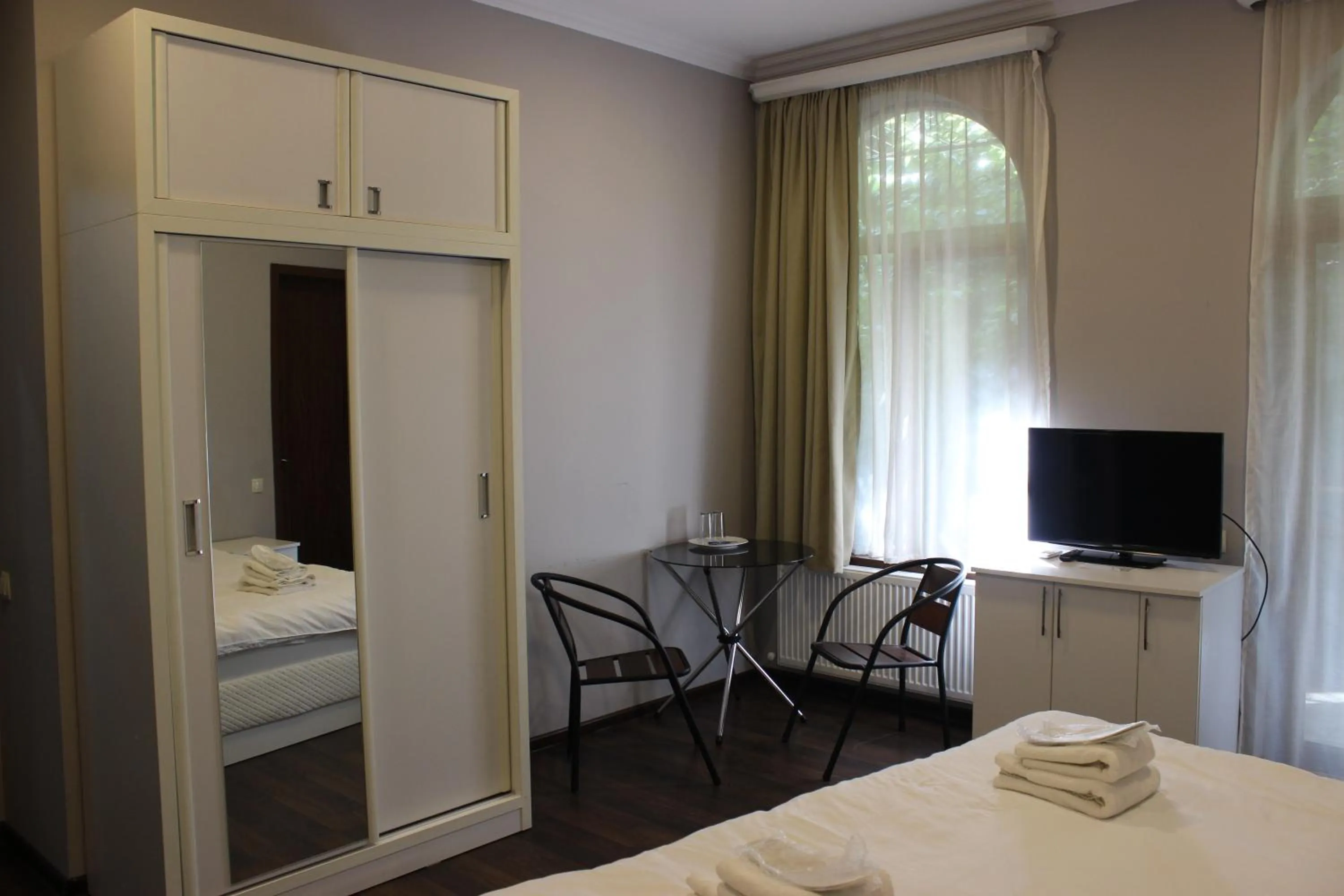 Communal lounge/ TV room, Bed in Point Hotel Tbilisi