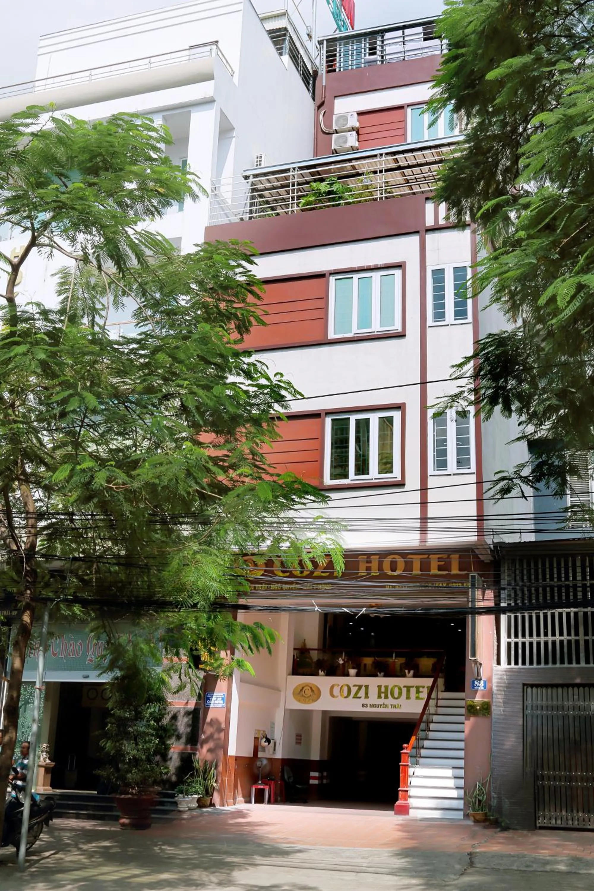 Property logo or sign in Cozi Hotel