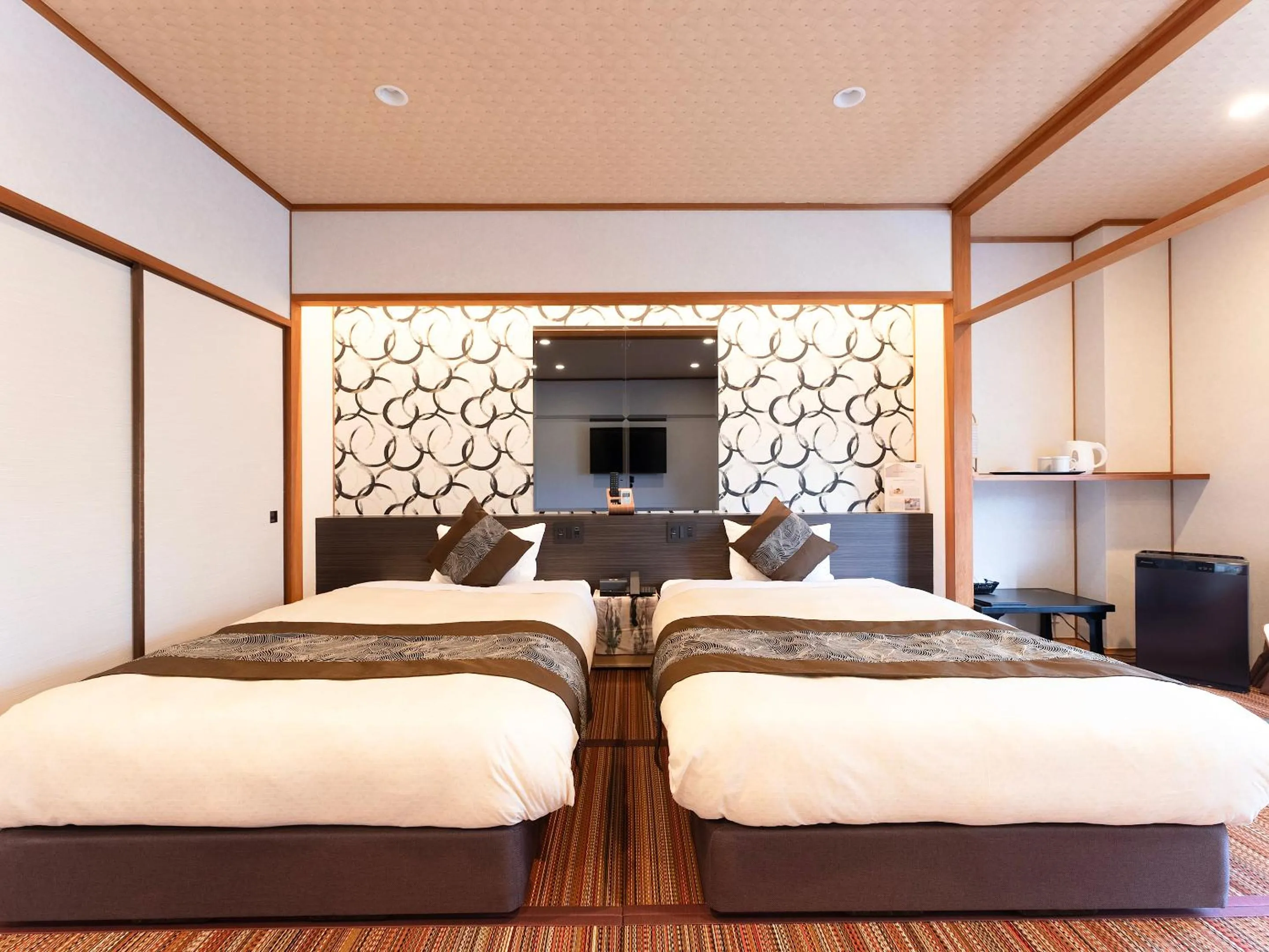 Bed in Livemax Resort Yuhigaura Kitu Onsen