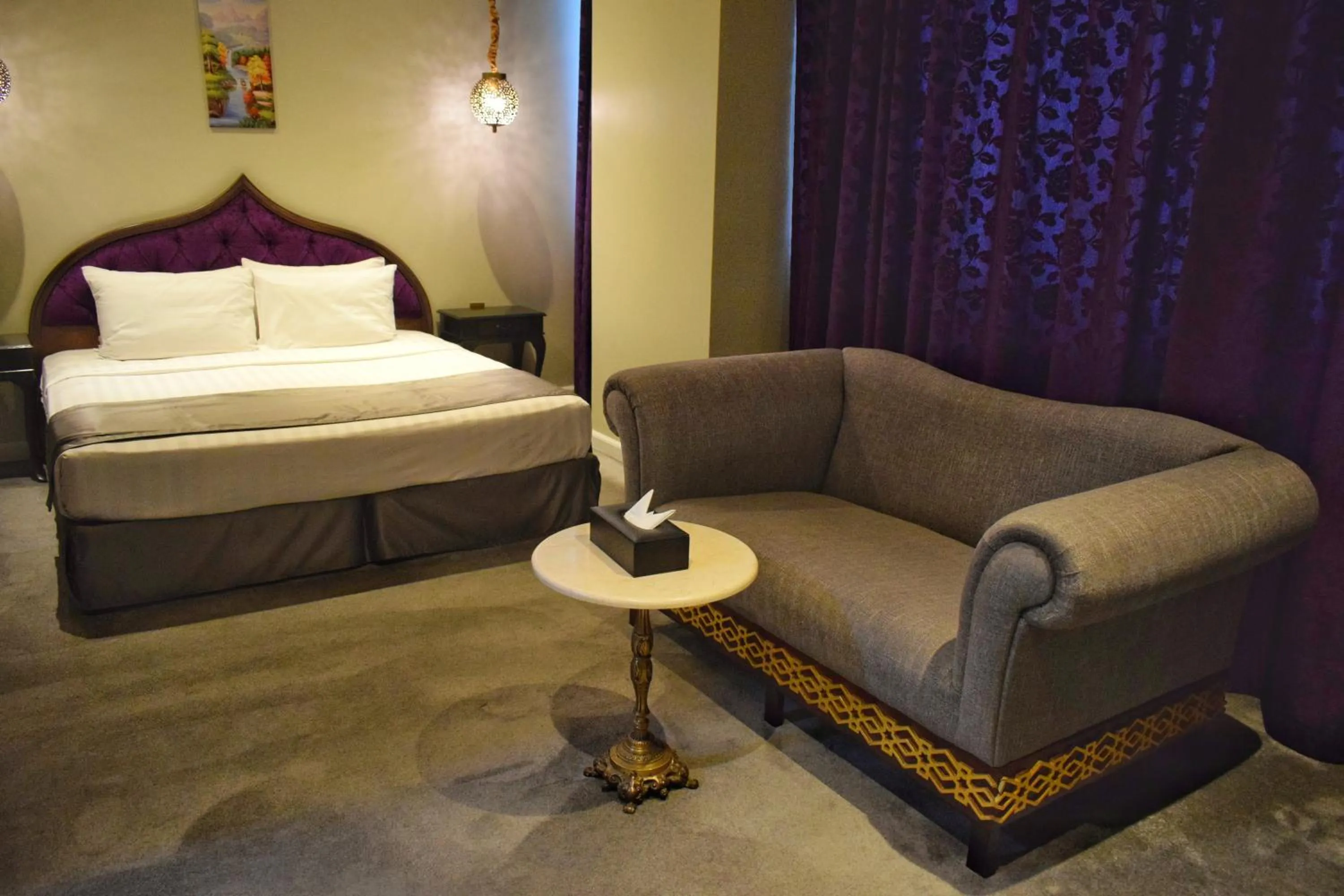 Living room, Bed in Saraya Corniche Hotel