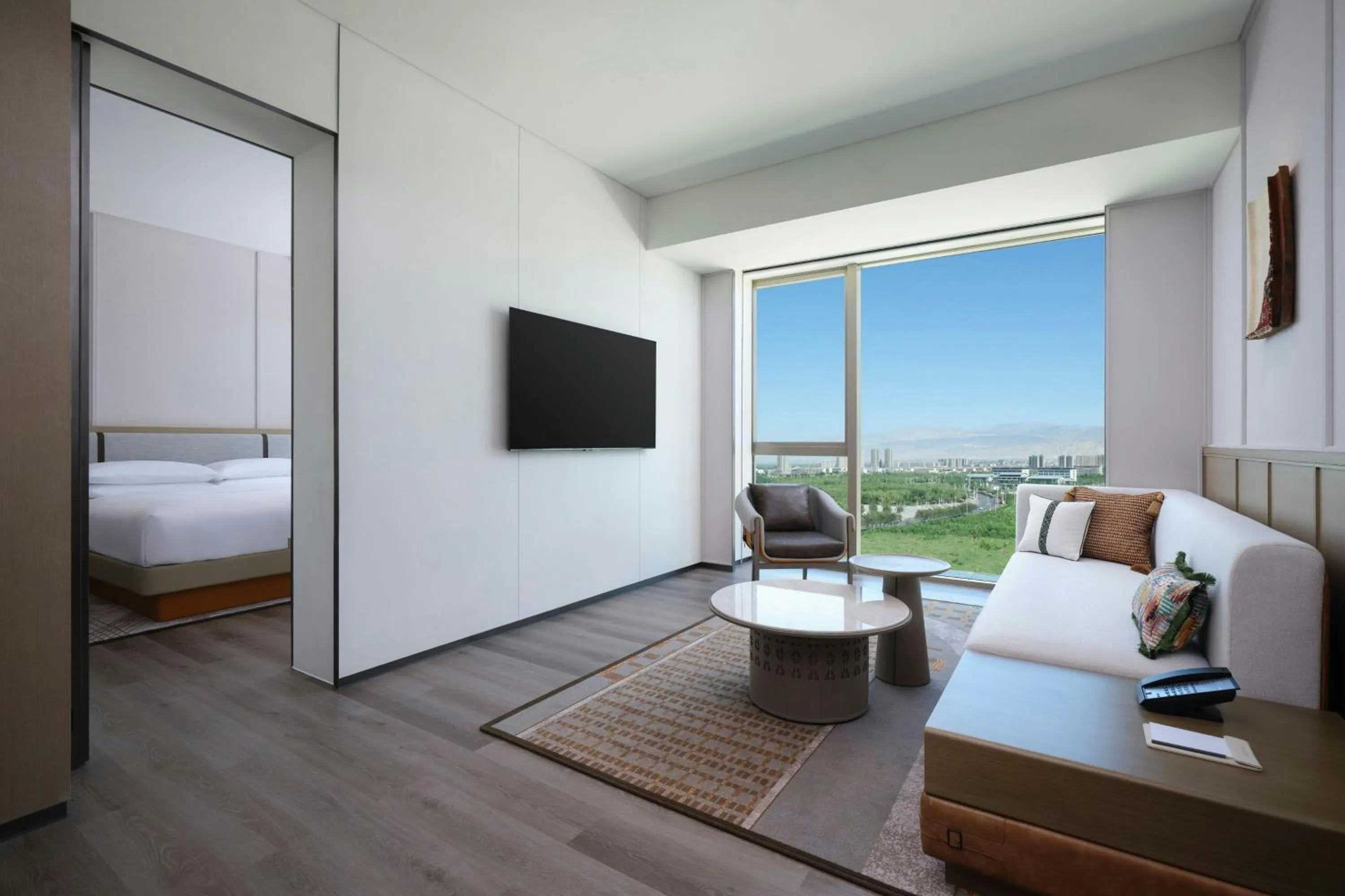 Living room, Bed in 库尔勒绿发万怡酒店