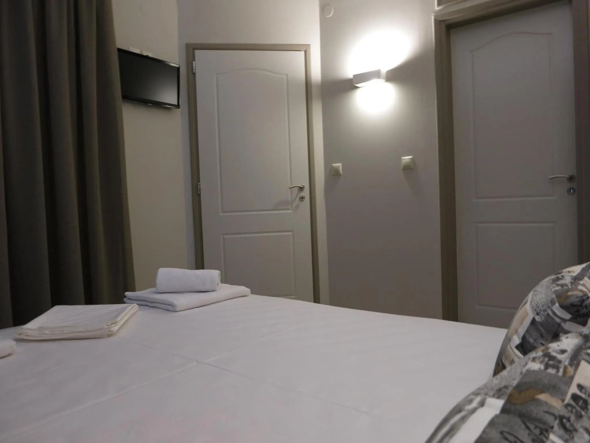 Bed in Pantheon Aparthotel