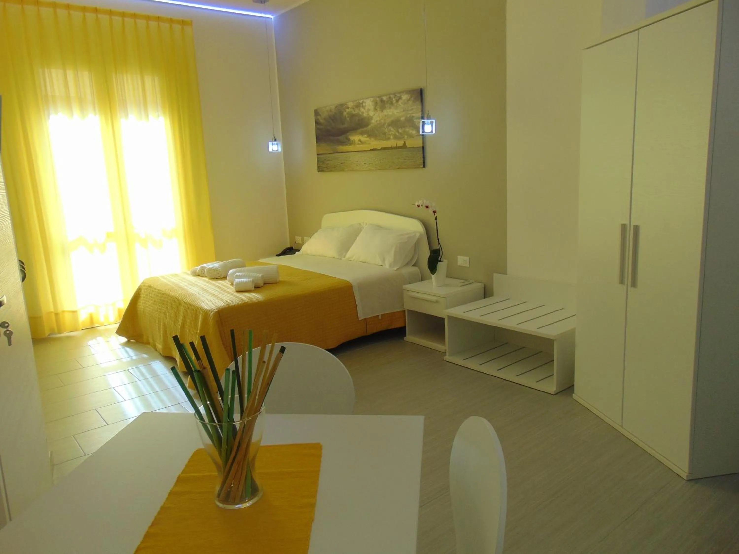 Seating area, Bed in Residence Le Isole