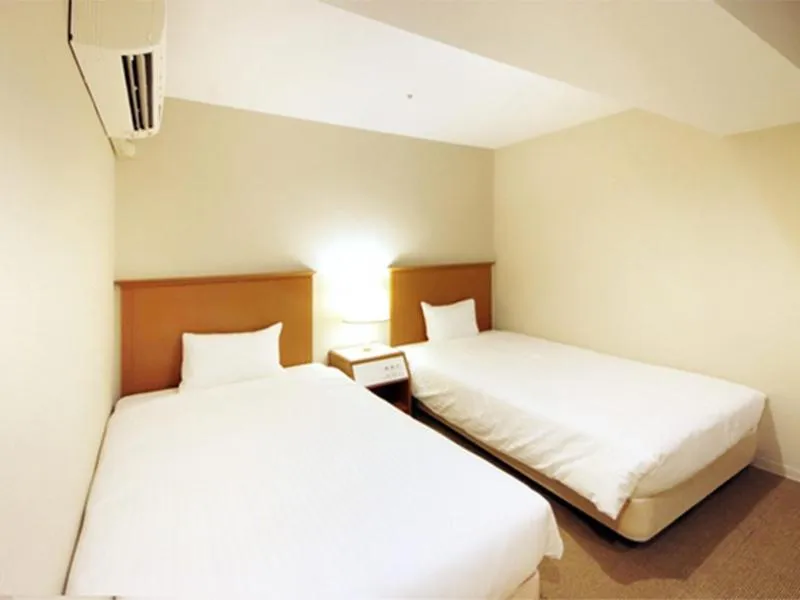 Bed in Quintessa Hotel Akita