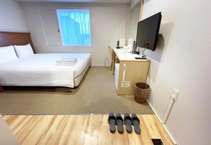 Bed in Quintessa Hotel Akita