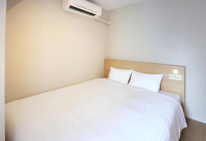 Bed in Quintessa Hotel Akita