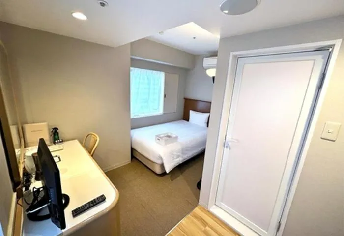 Bed in Quintessa Hotel Akita