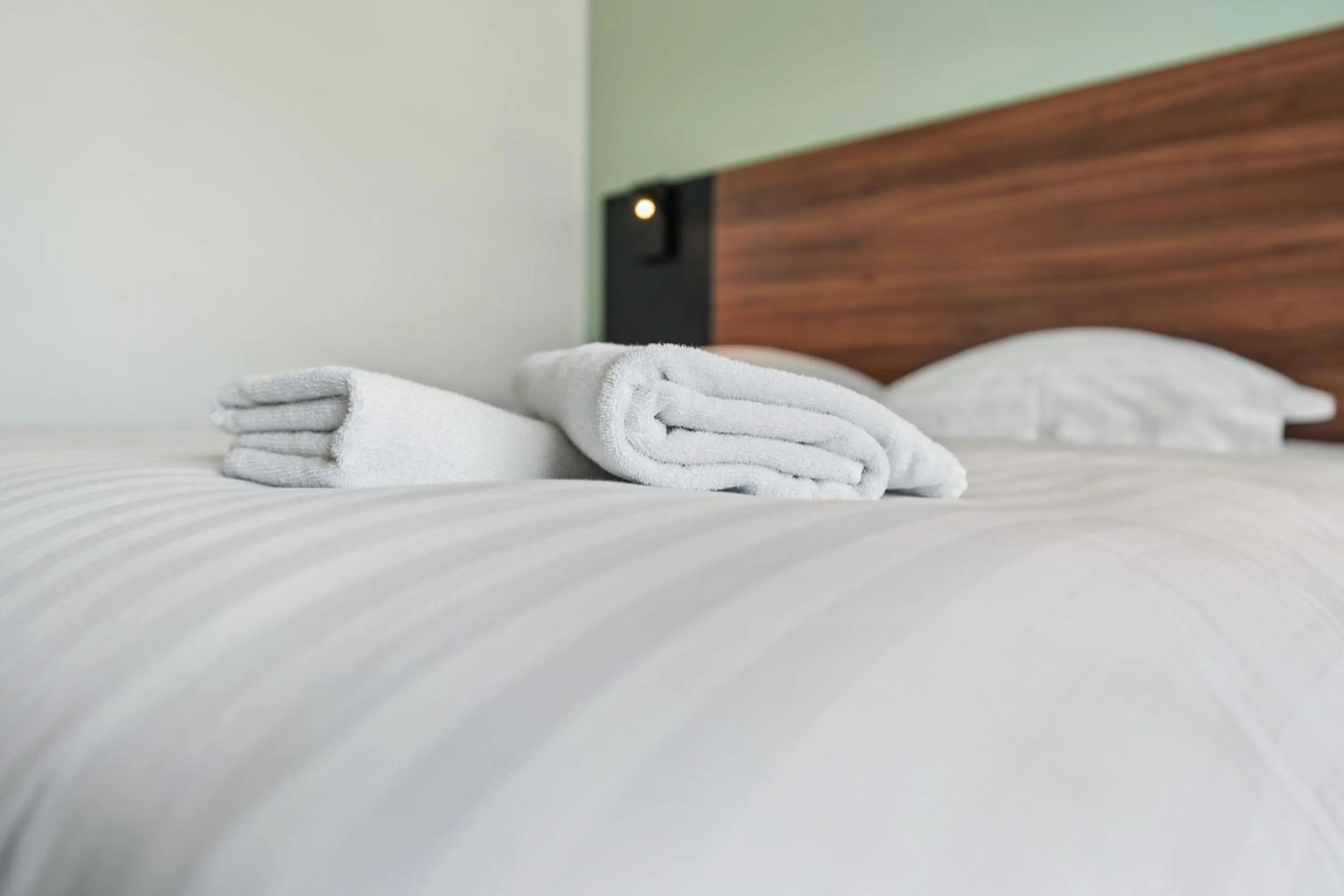 towels, Bed in Hôtel Akena Pierrelaye