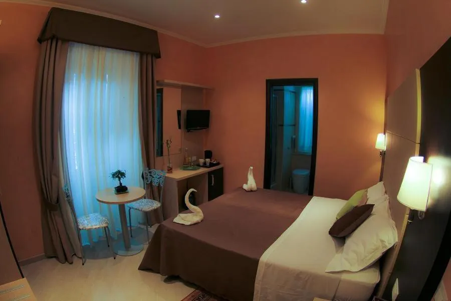 Bed in Candia Inn Vatican