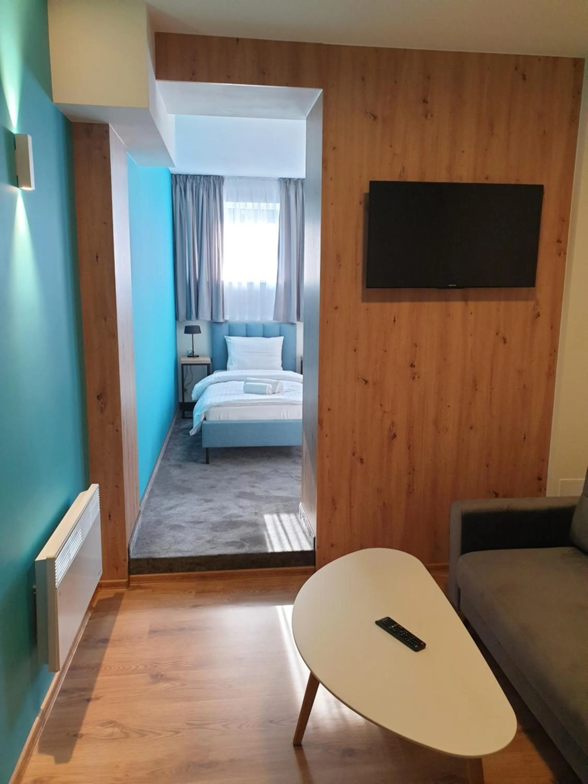 Seating area, Bed in Kelman Inn Global Nowa Sól