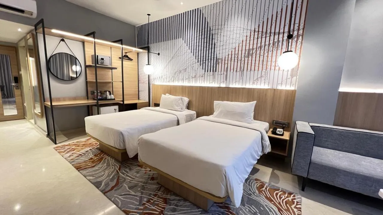 Bed in Hotel Manorama Vijayawada