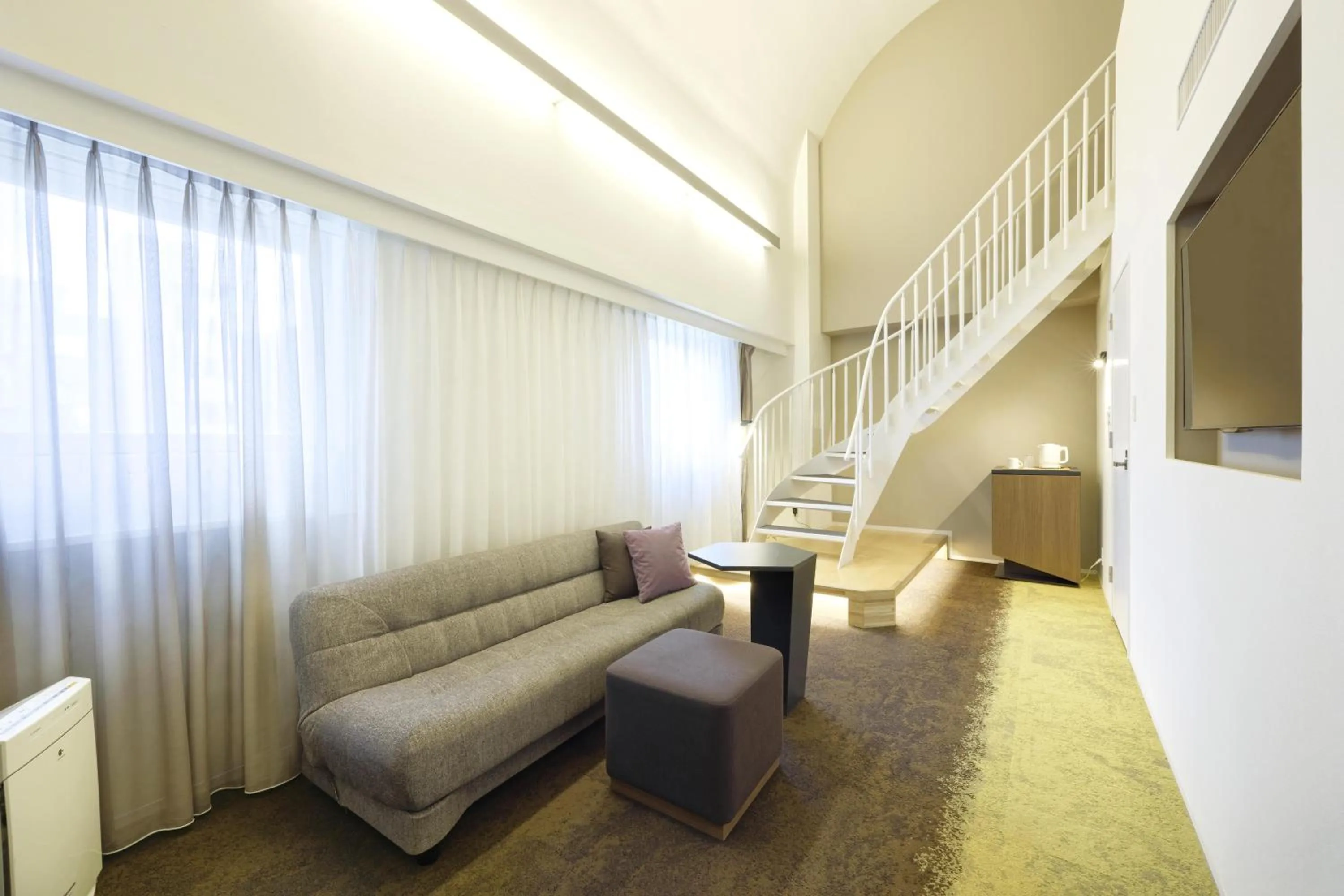 Living room in Holiday Inn & Suites Sapporo Odori Park by IHG