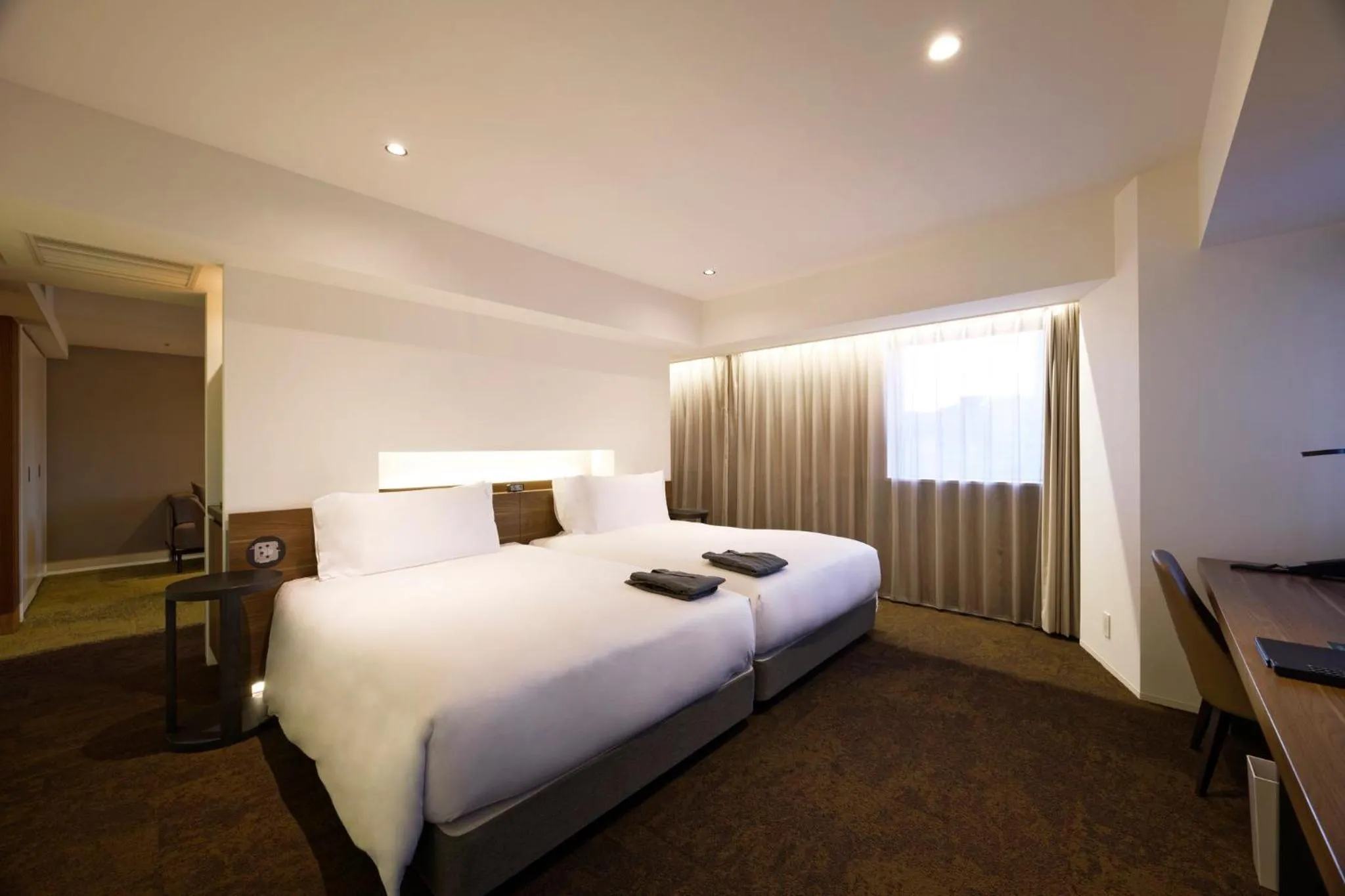 Photo of the whole room, Bed in Holiday Inn & Suites Sapporo Odori Park by IHG