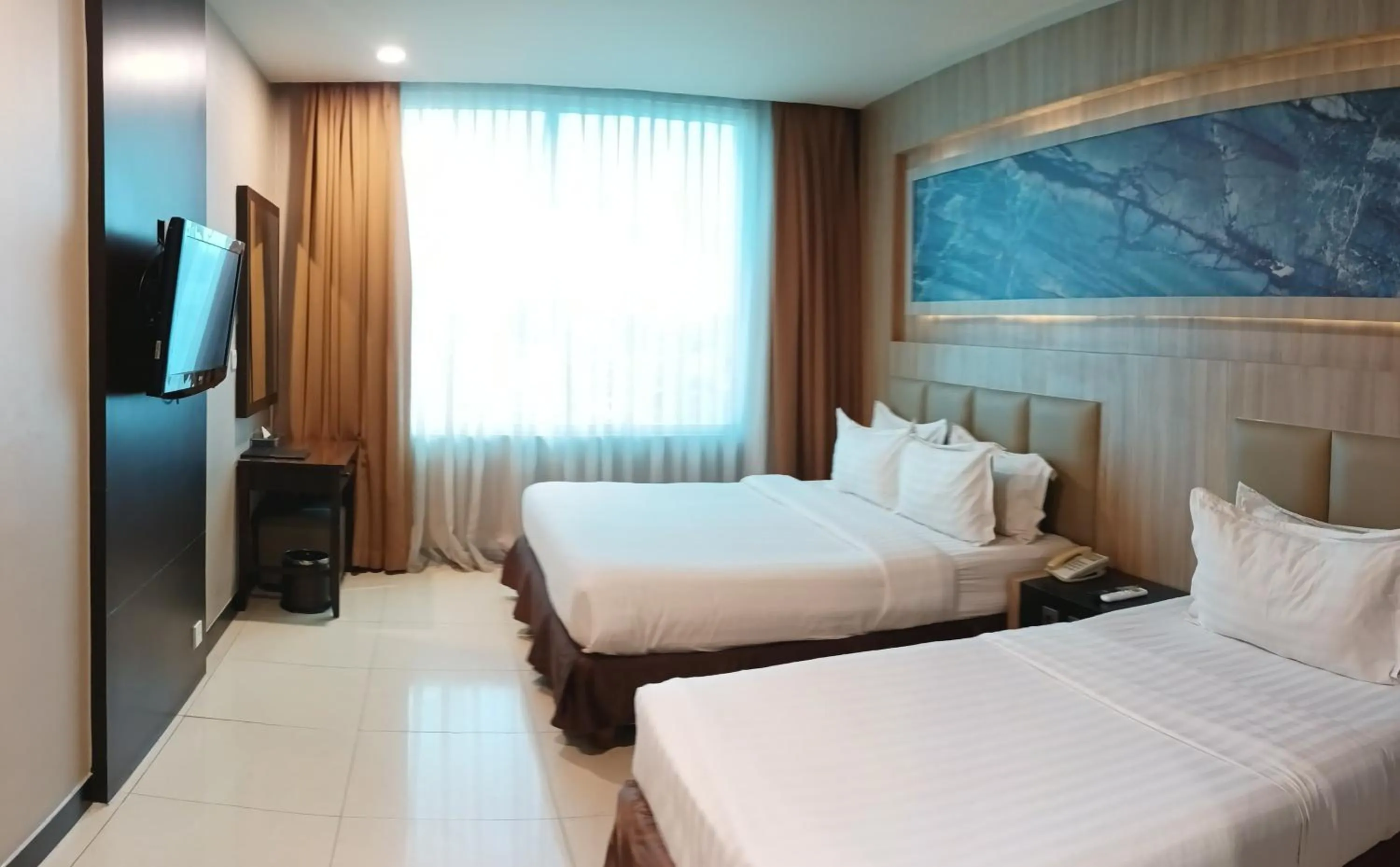 Bed in Grand Paragon Hotel