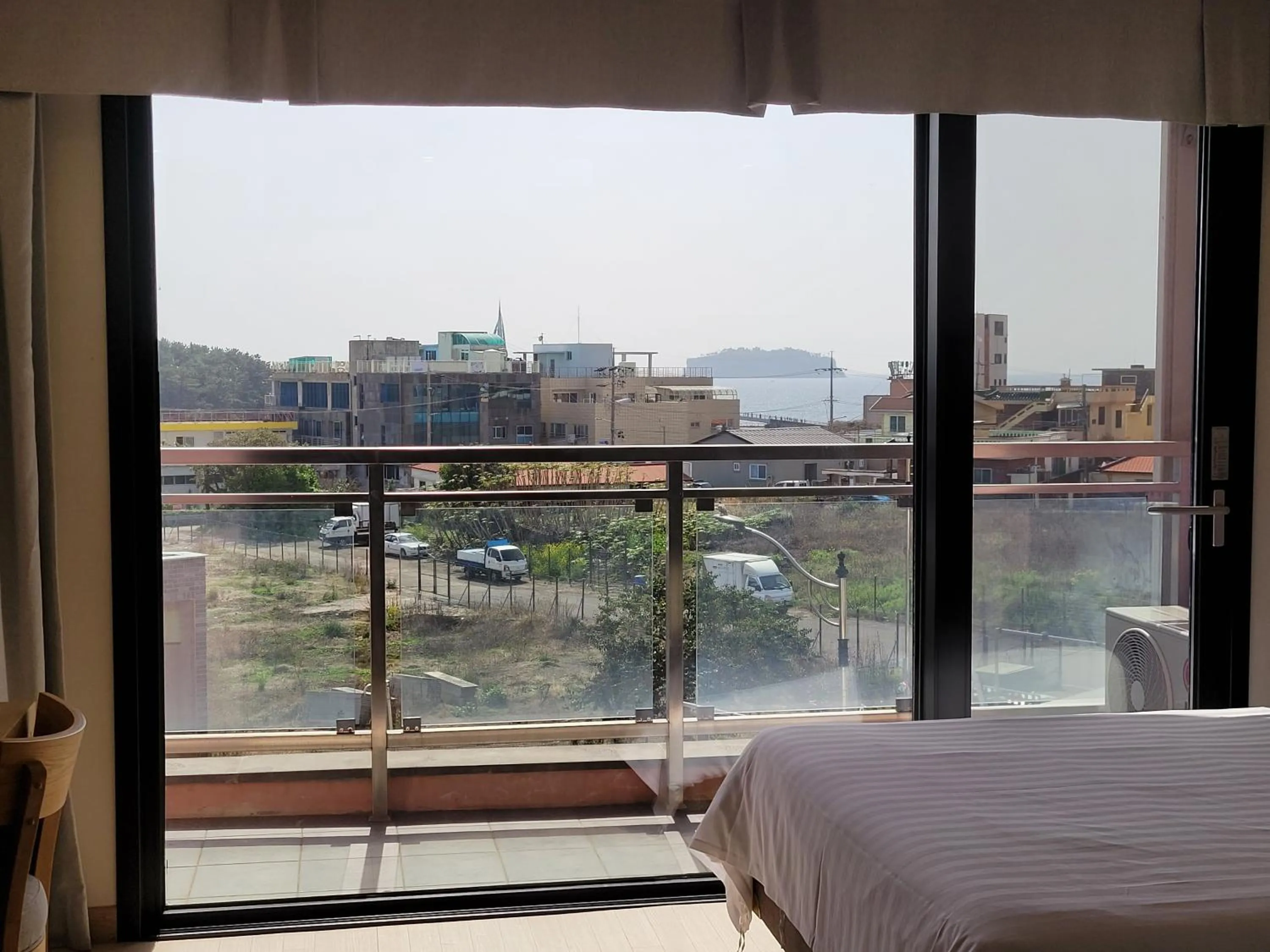 View (from property/room), Bed in BK Hotel Jeju