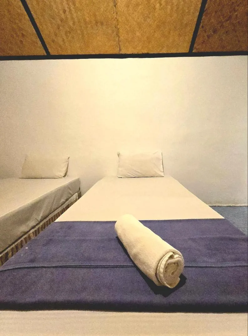 Bed in Kradan Beach Resort