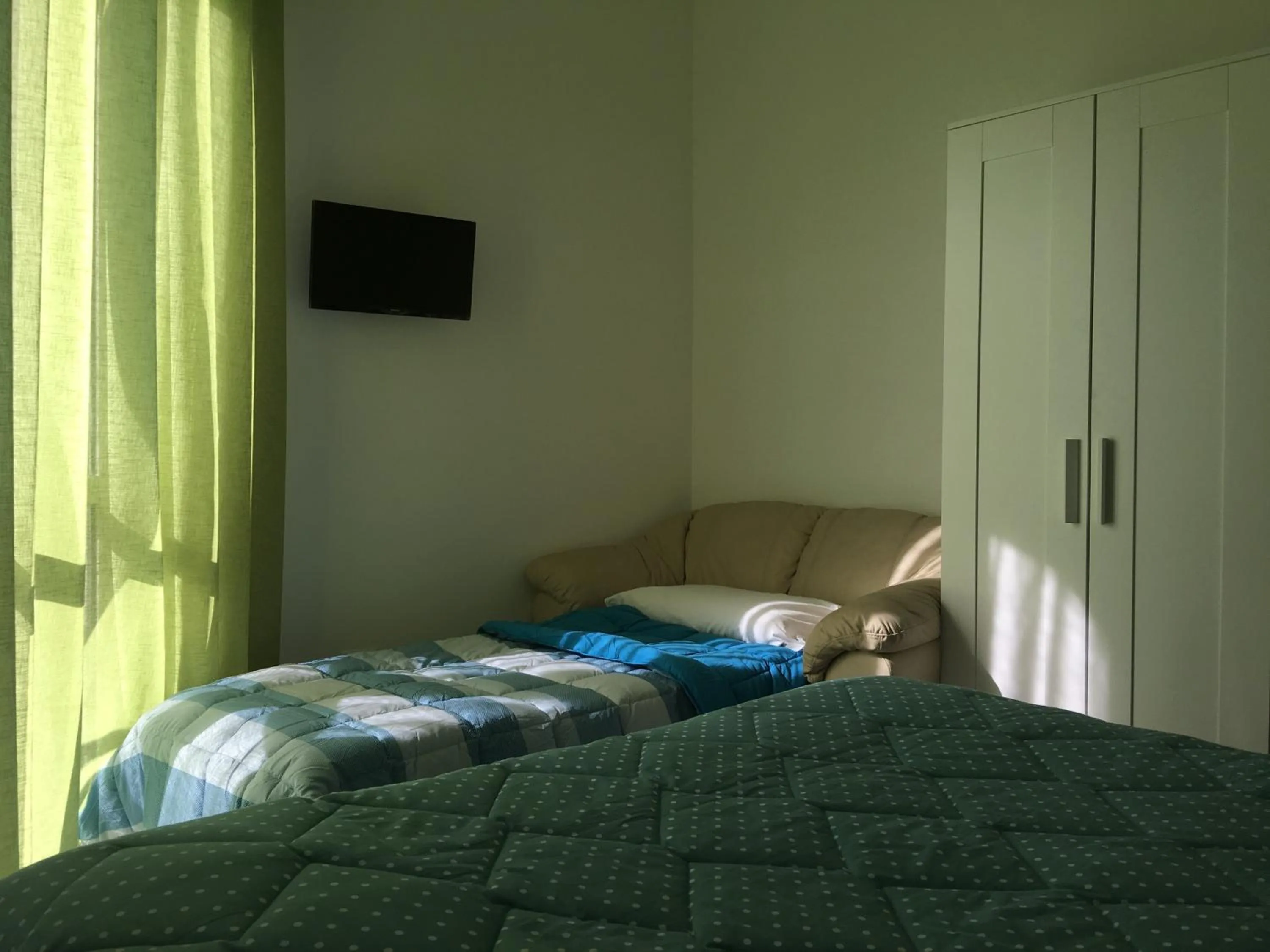 Decorative detail, Bed in Top Floor Rentrooms Napoli