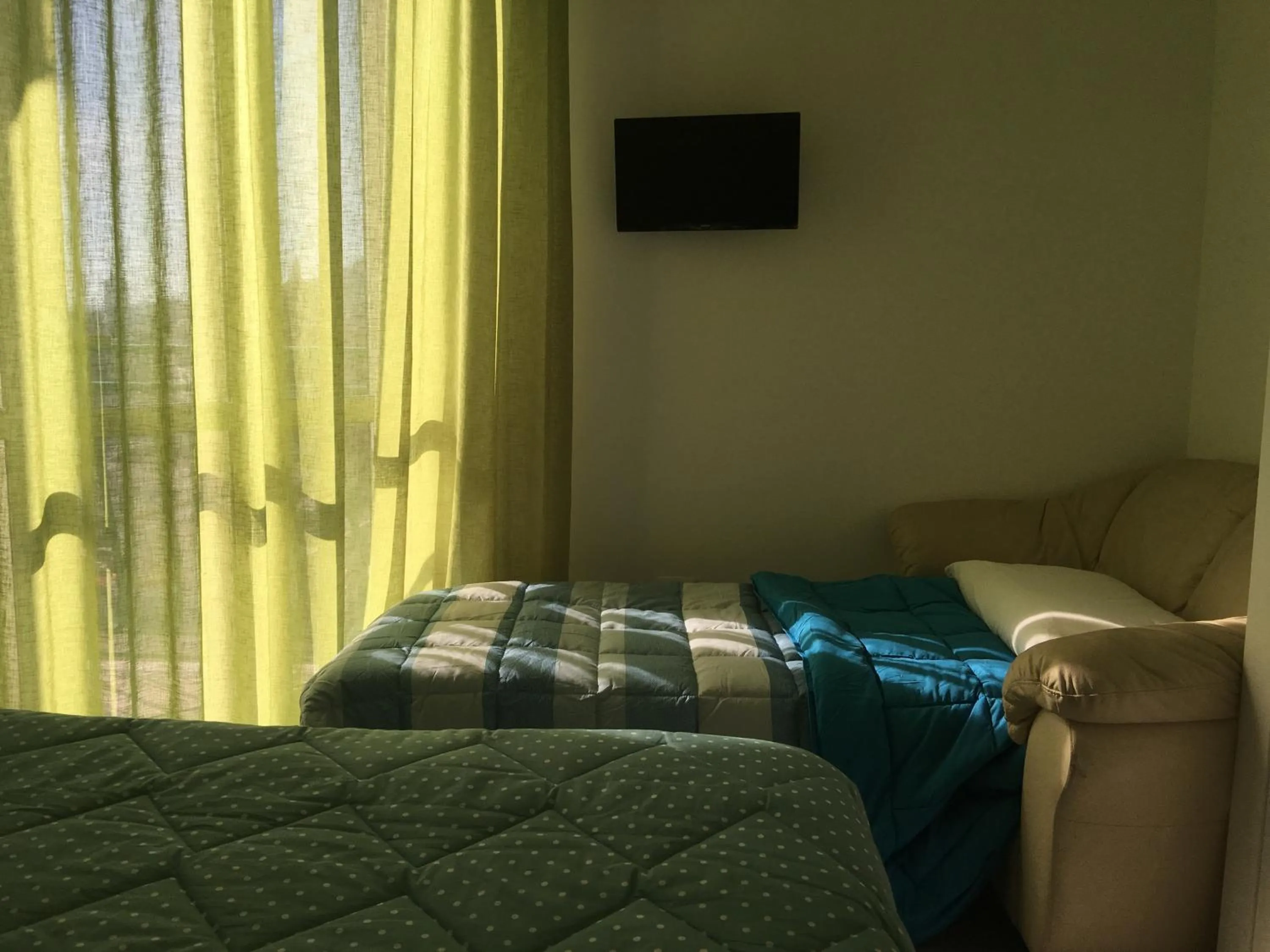 Decorative detail, Bed in Top Floor Rentrooms Napoli