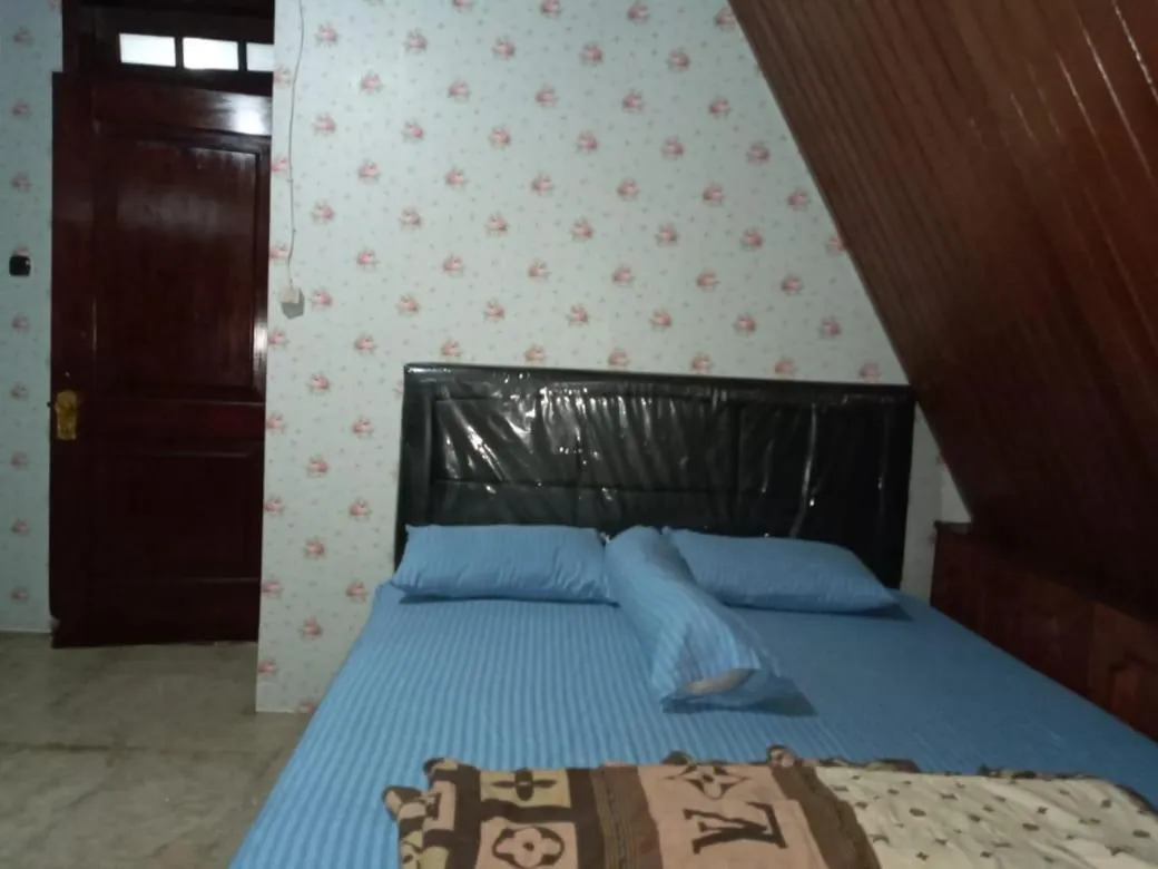 Bed in Mayestik Guest House Syariah
