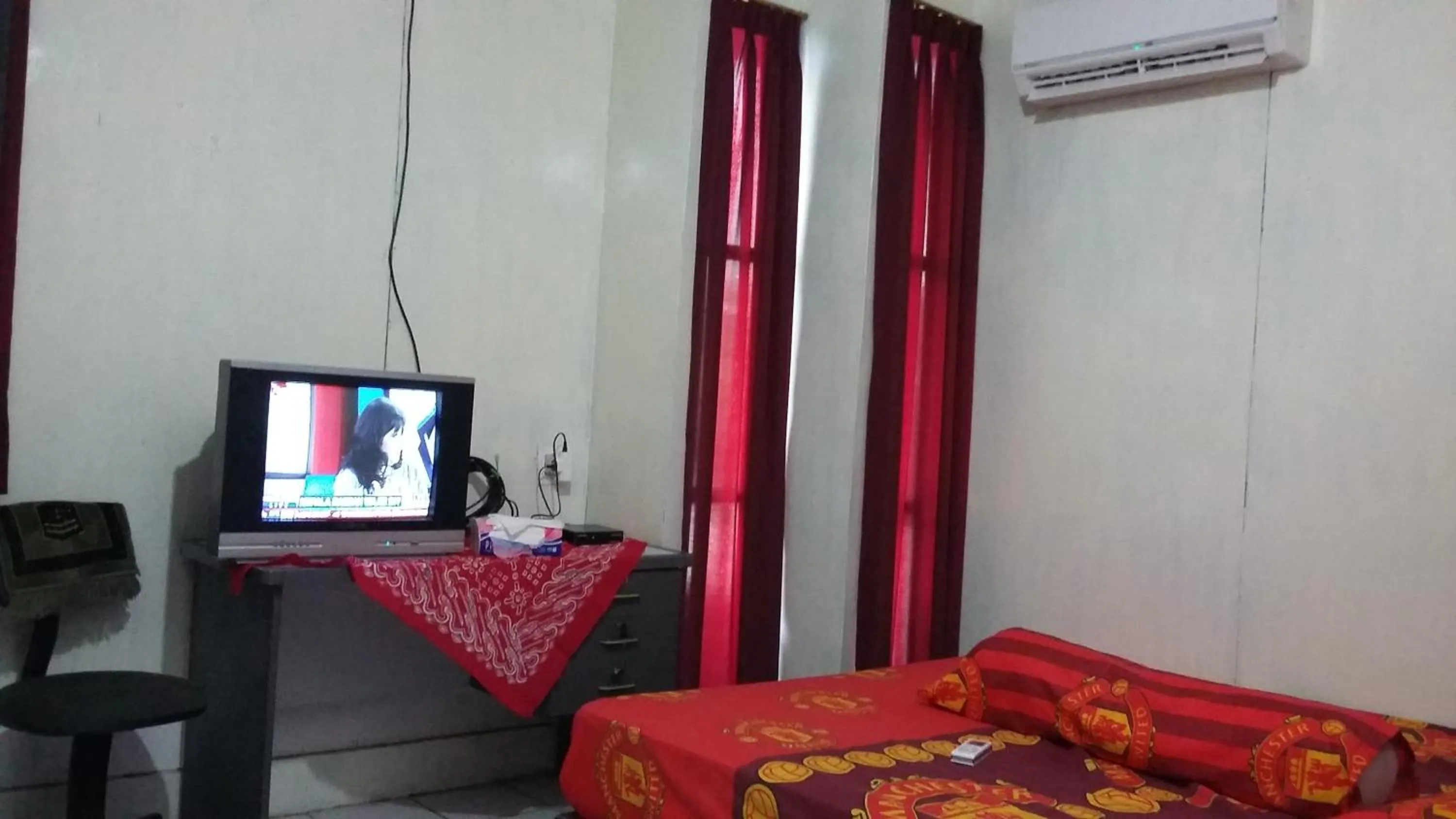 Bed in Mayestik Guest House Syariah