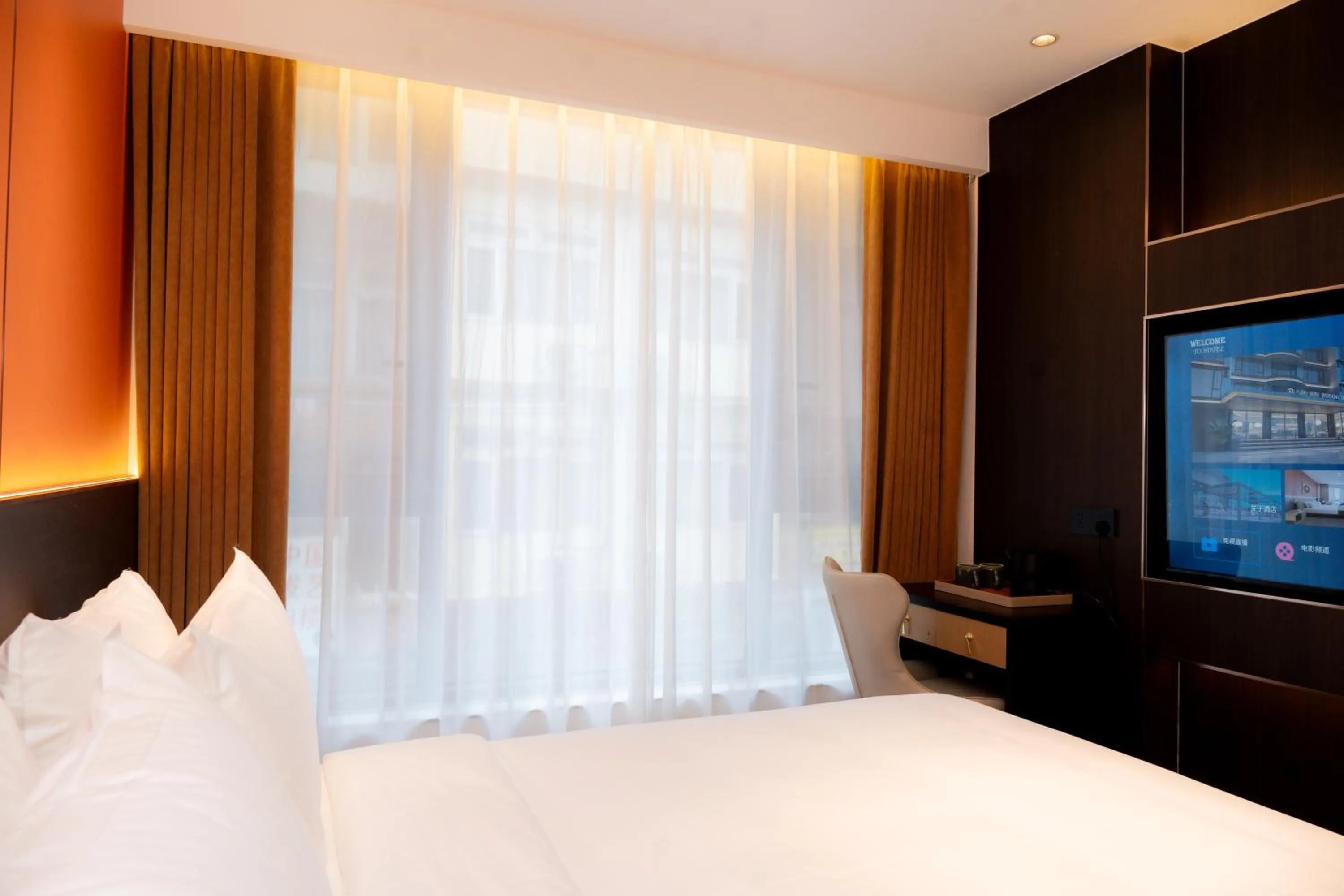 Bed in Jiuding Joy Hotel