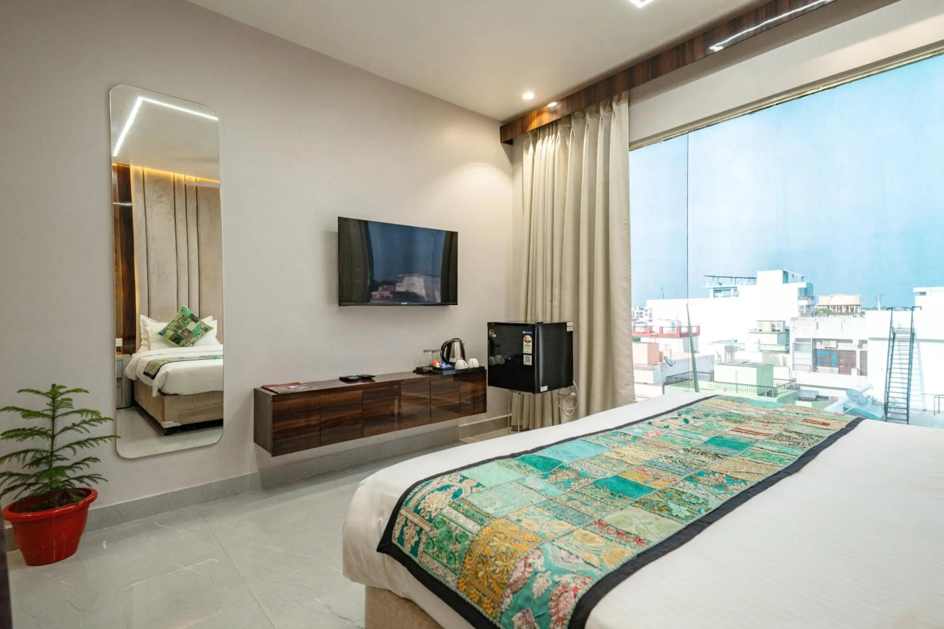 Bed in Tripli Hotels Evara Inn