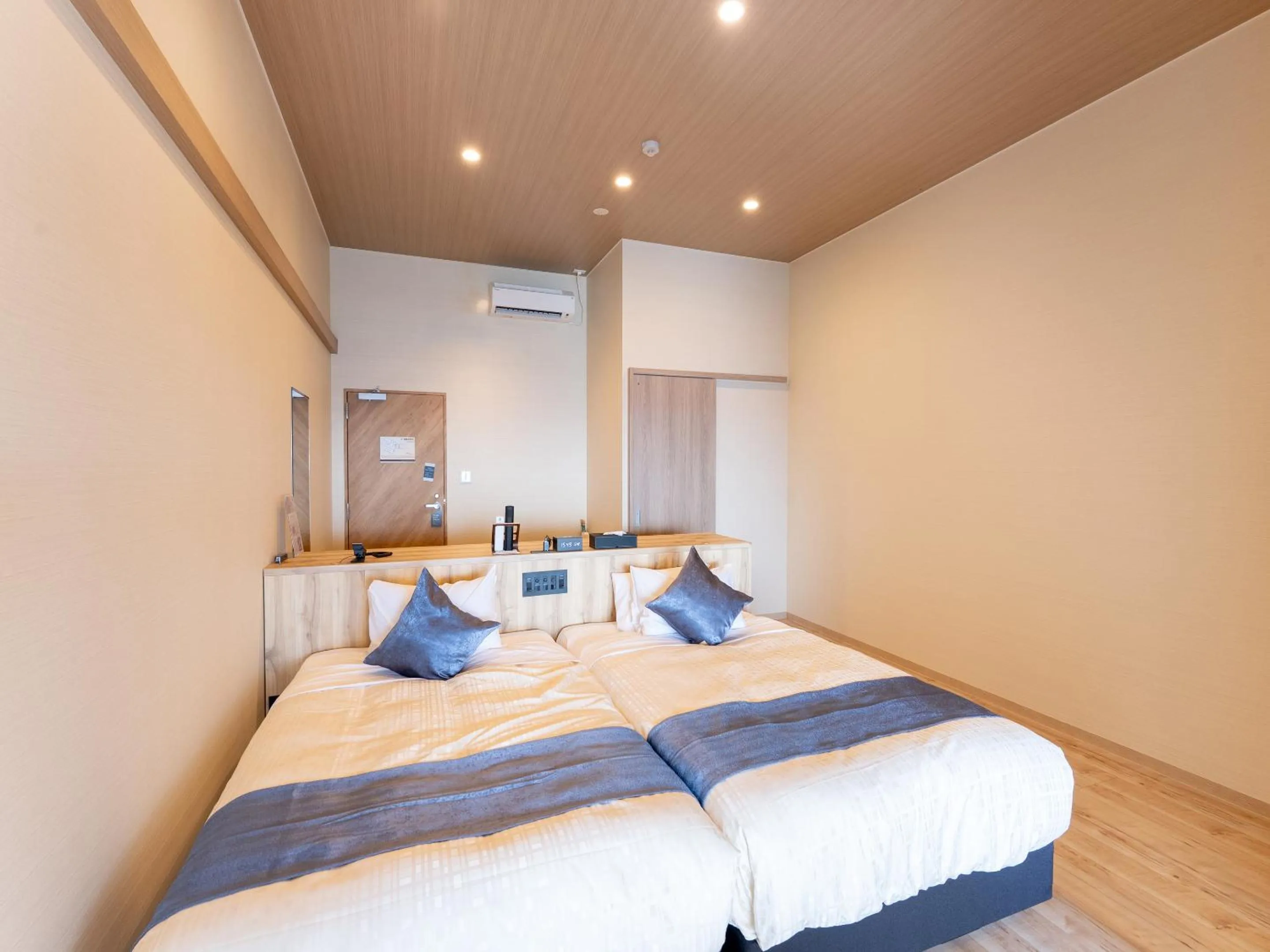 Bed in Livemax Resort Inami Seafront