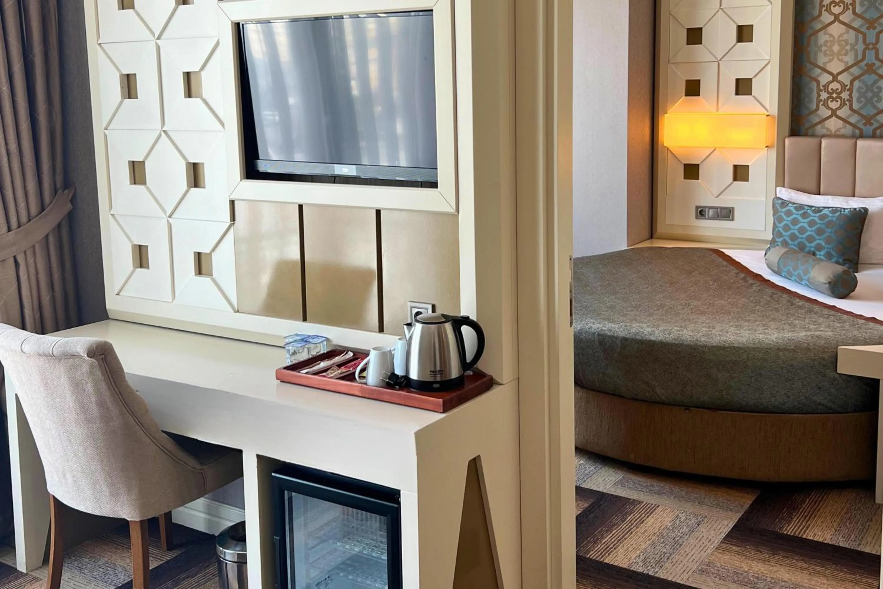 Bed in The Grand Mira Business Hotel