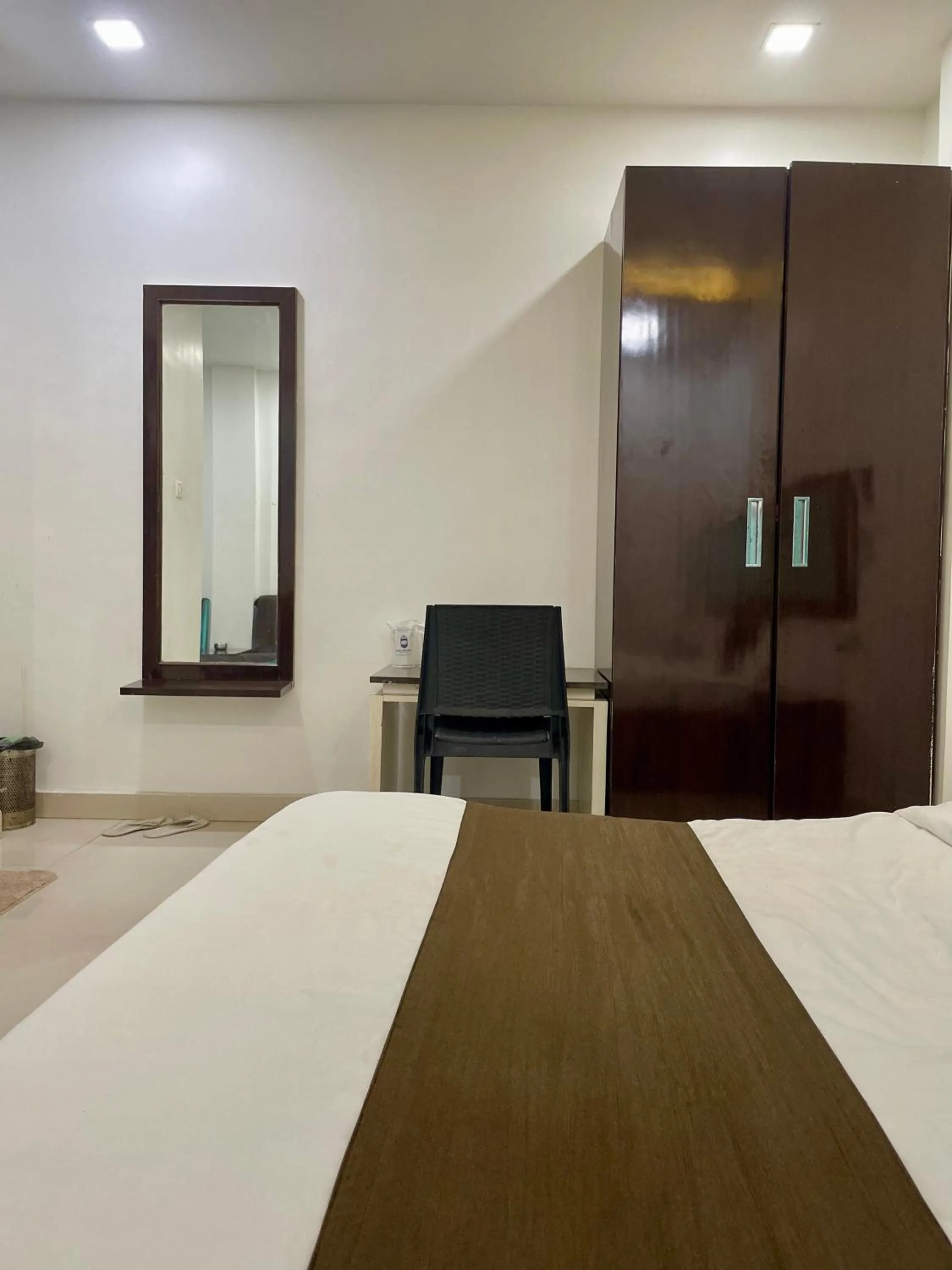 Photo of the whole room, Bed in Hotel Komal Palace Anand Nagar