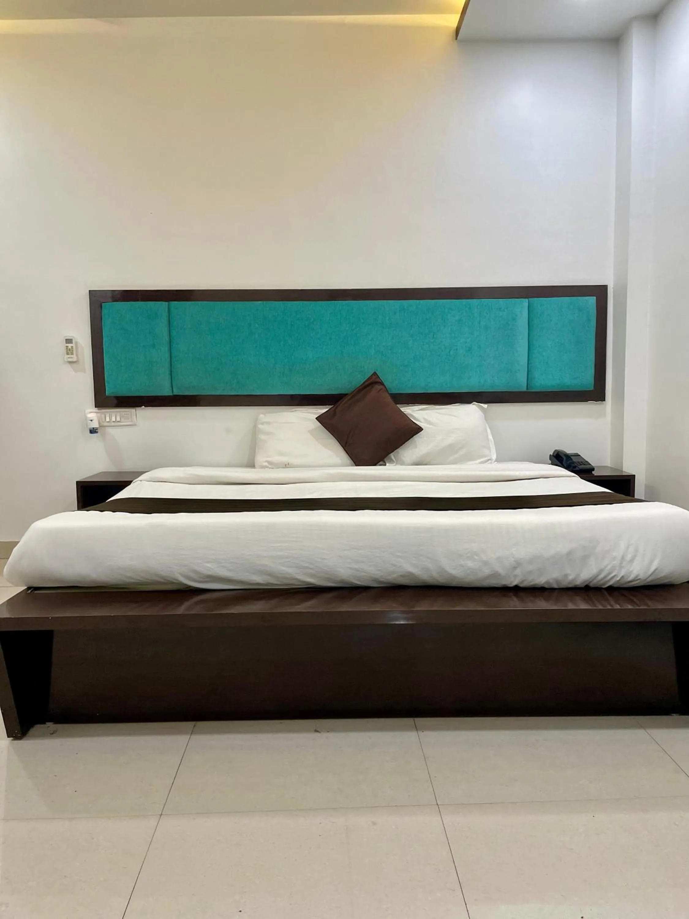 Photo of the whole room, Bed in Hotel Komal Palace Anand Nagar