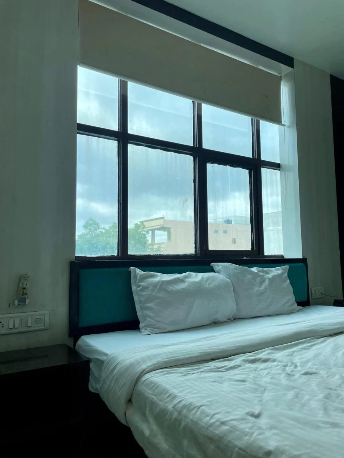 Photo of the whole room, Bed in Hotel Komal Palace Anand Nagar