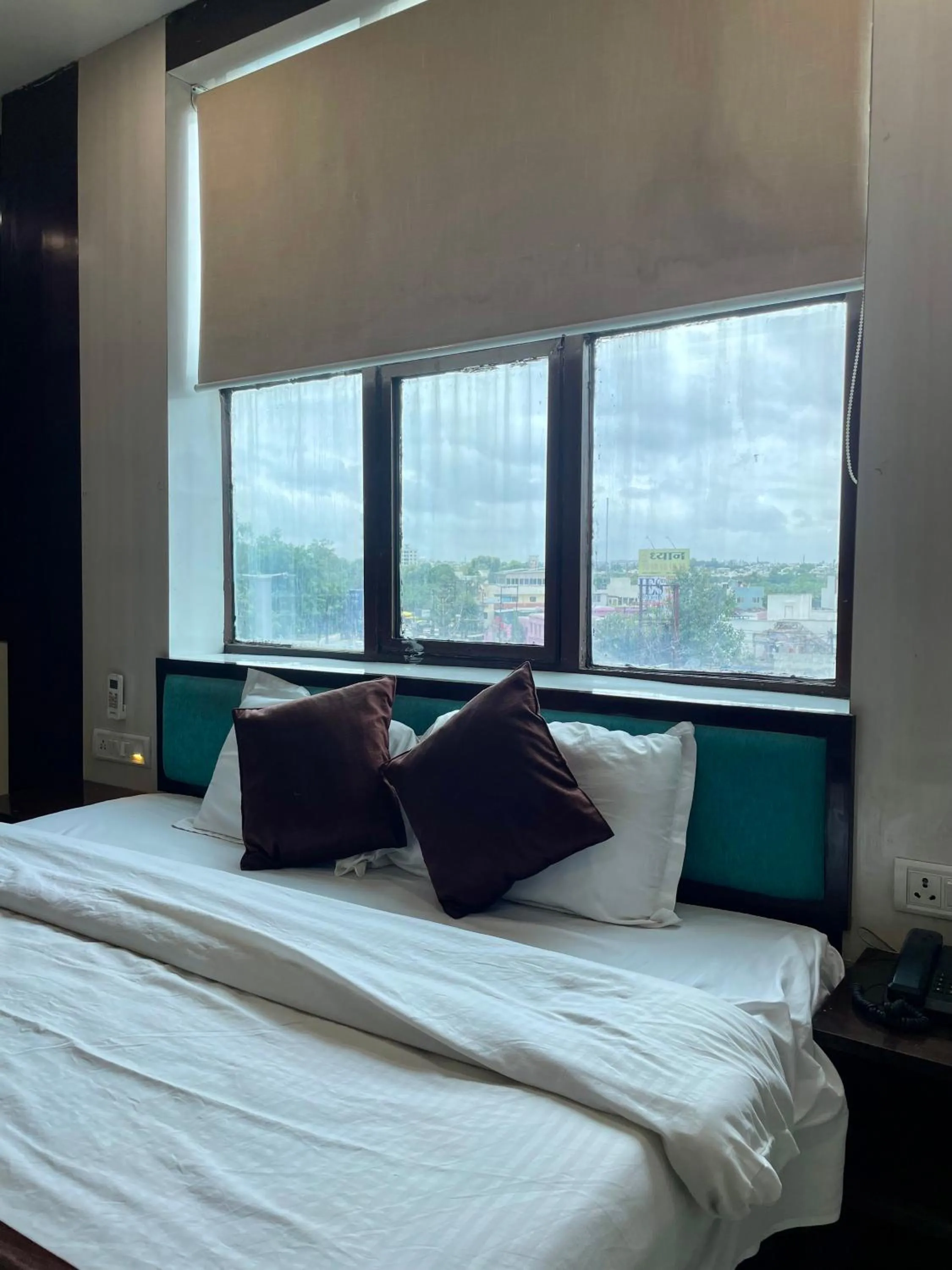 Photo of the whole room, Bed in Hotel Komal Palace Anand Nagar