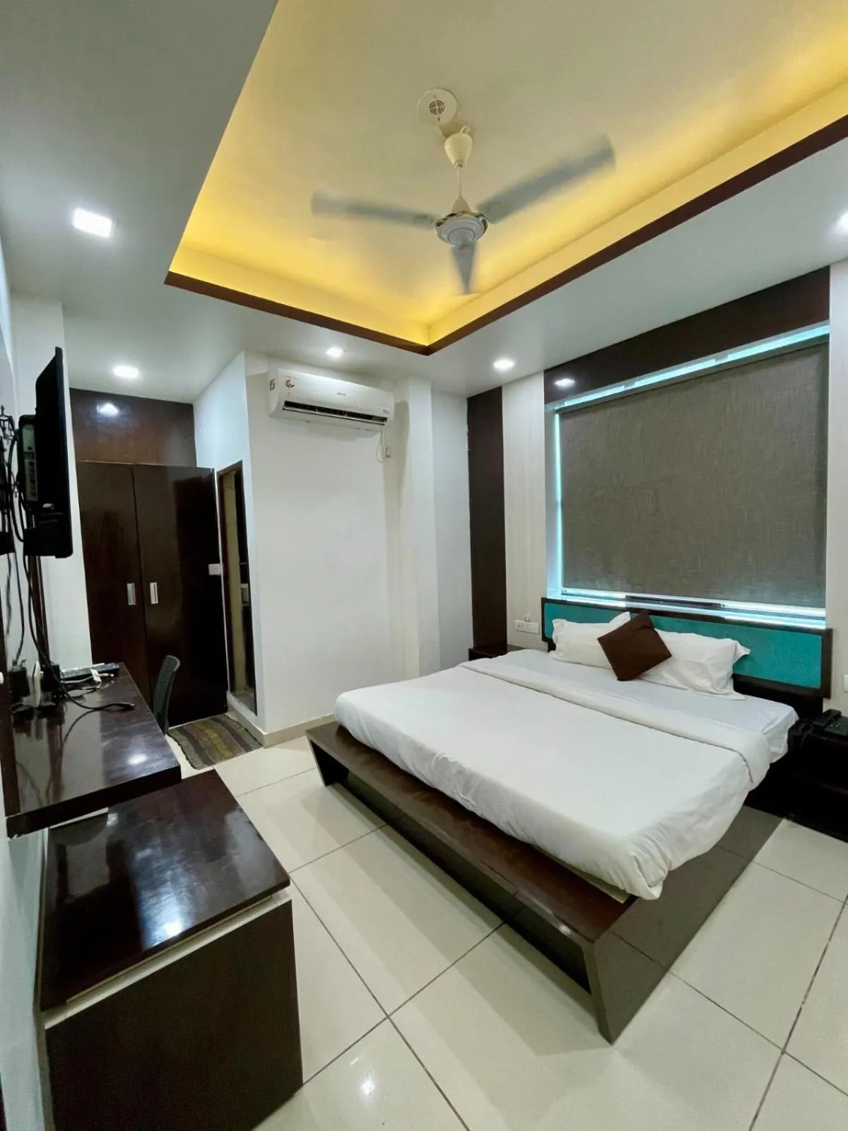 Photo of the whole room, Bed in Hotel Komal Palace Anand Nagar