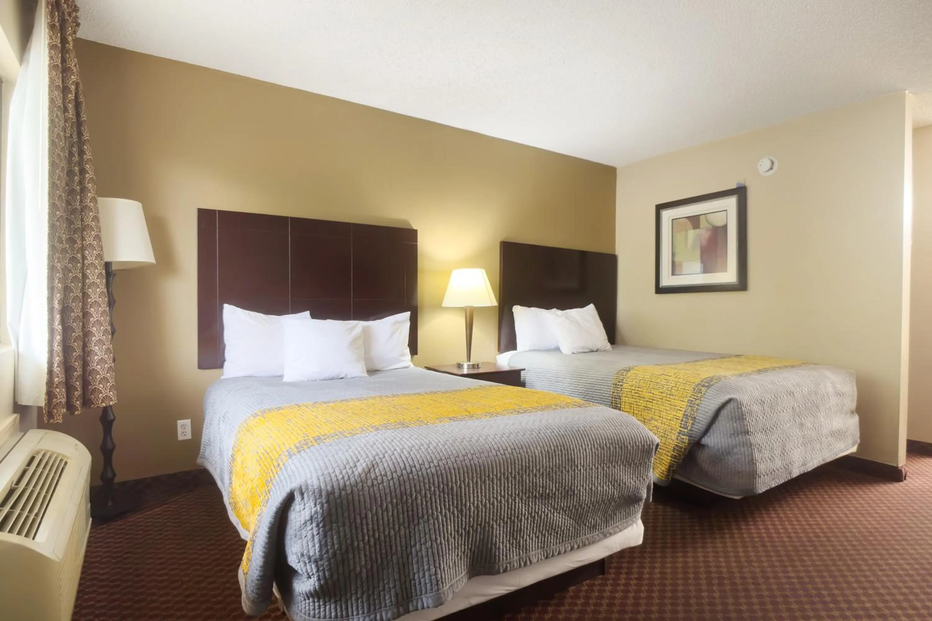 Bedroom, Bed in Deerfield Inn By Capital O Blytheville AR I55