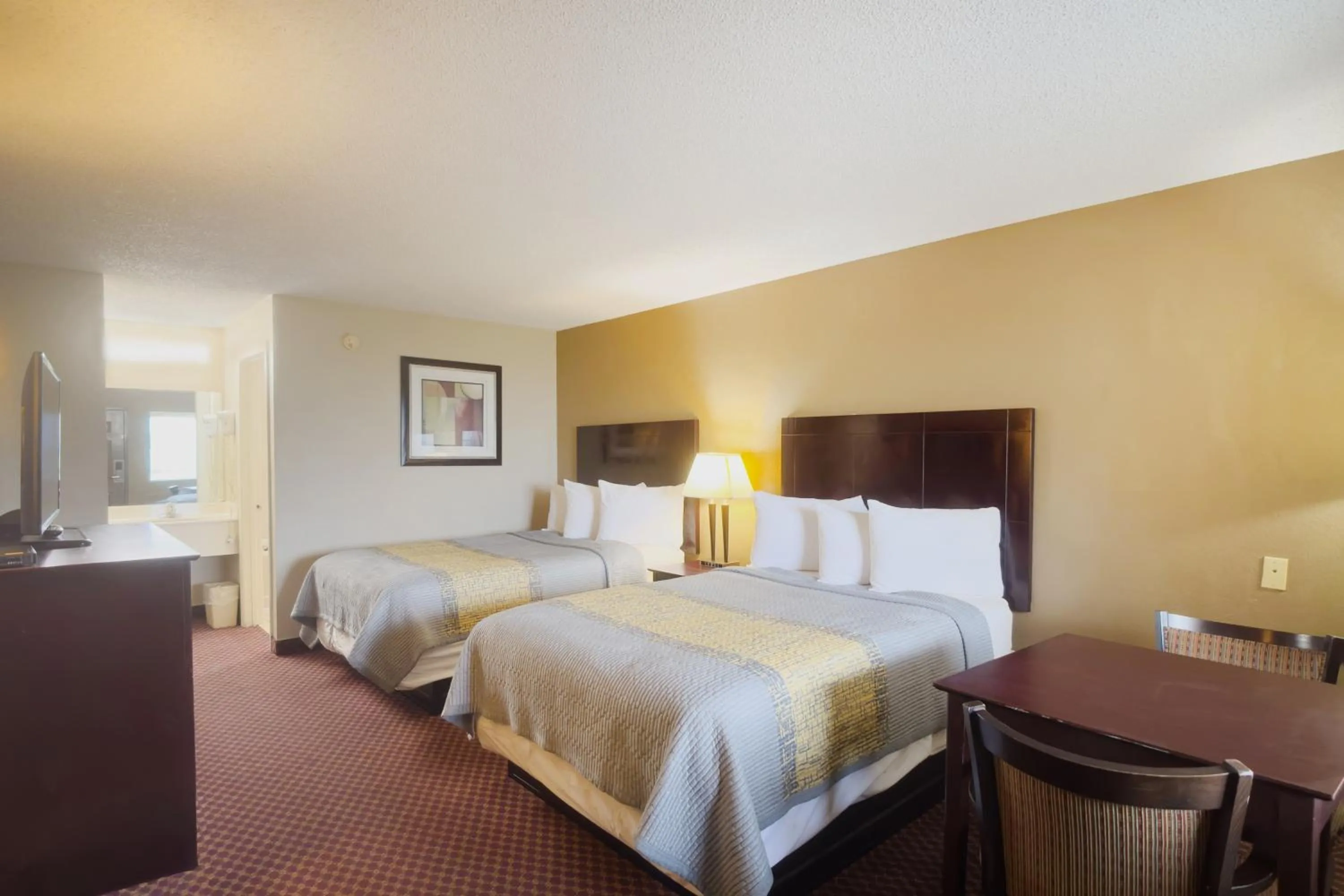 Bedroom, Bed in Deerfield Inn By Capital O Blytheville AR I55