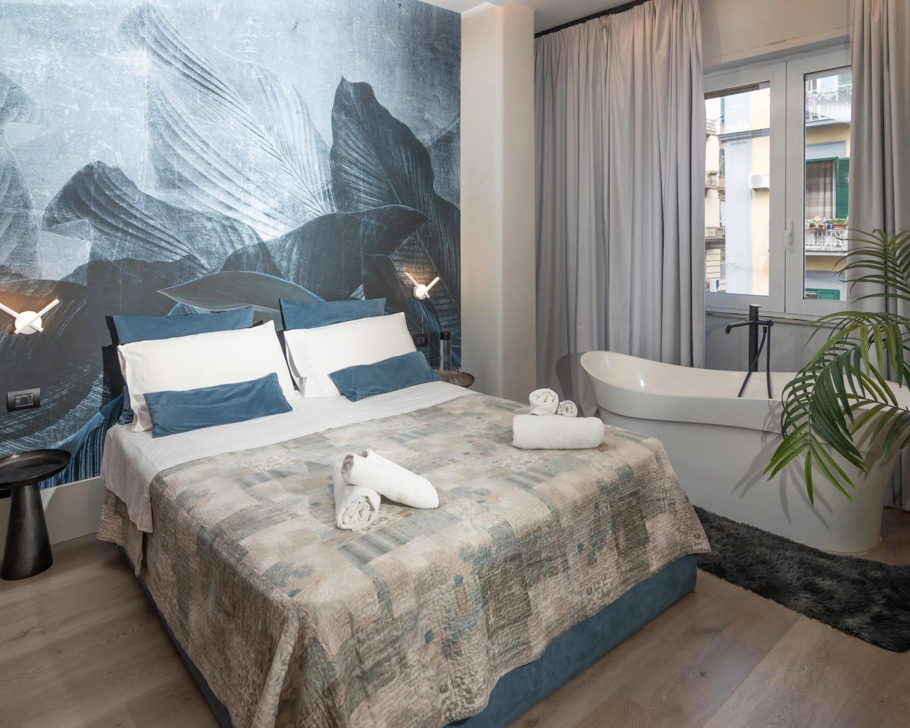 Bed in VESUVIANUS Rooms and More