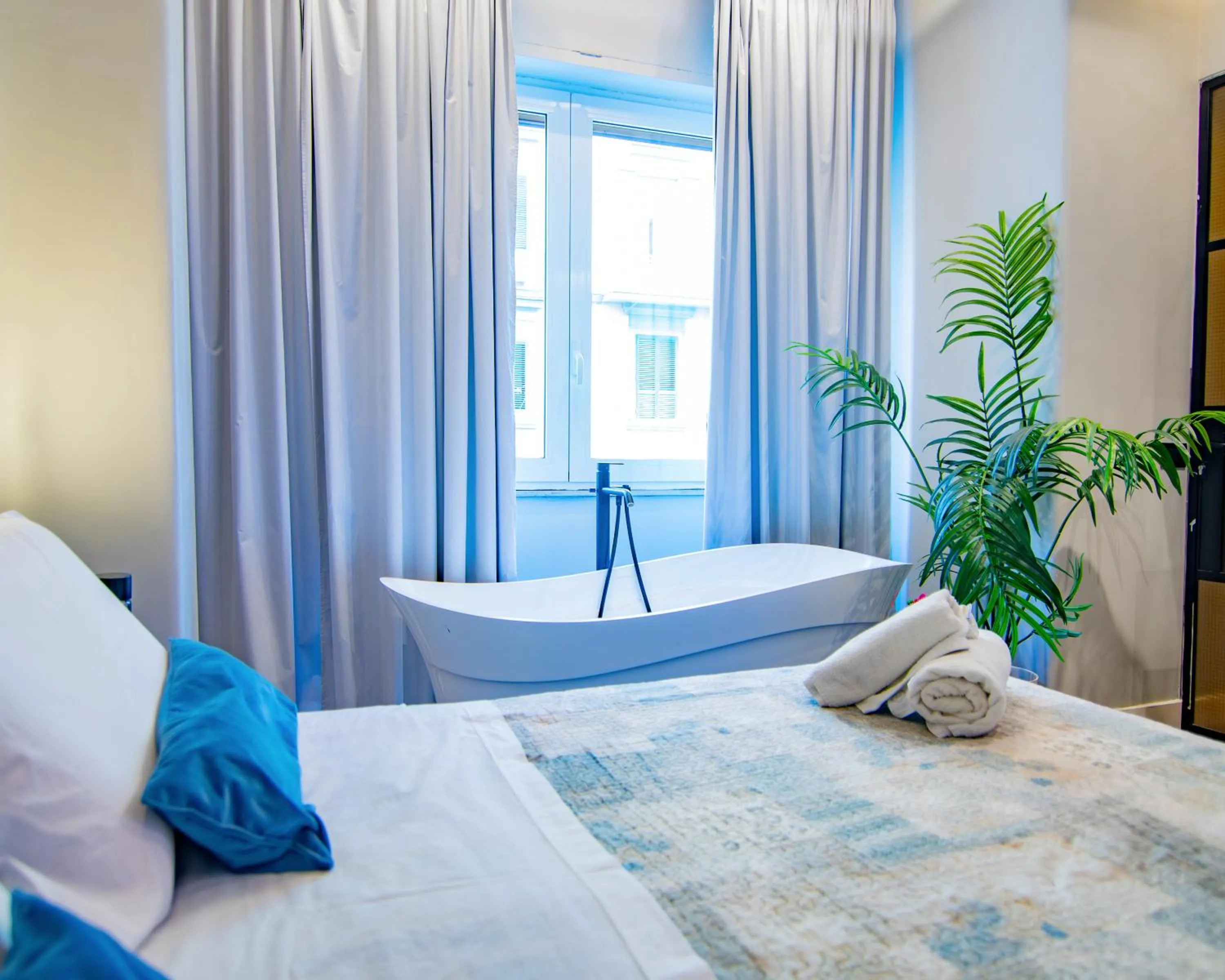 Bed in VESUVIANUS Rooms and More