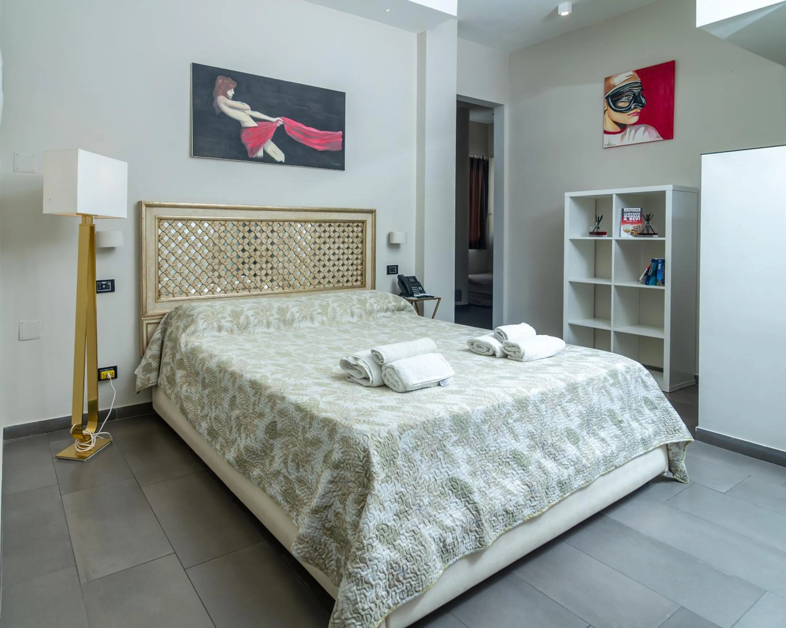 Bed in VESUVIANUS Rooms and More