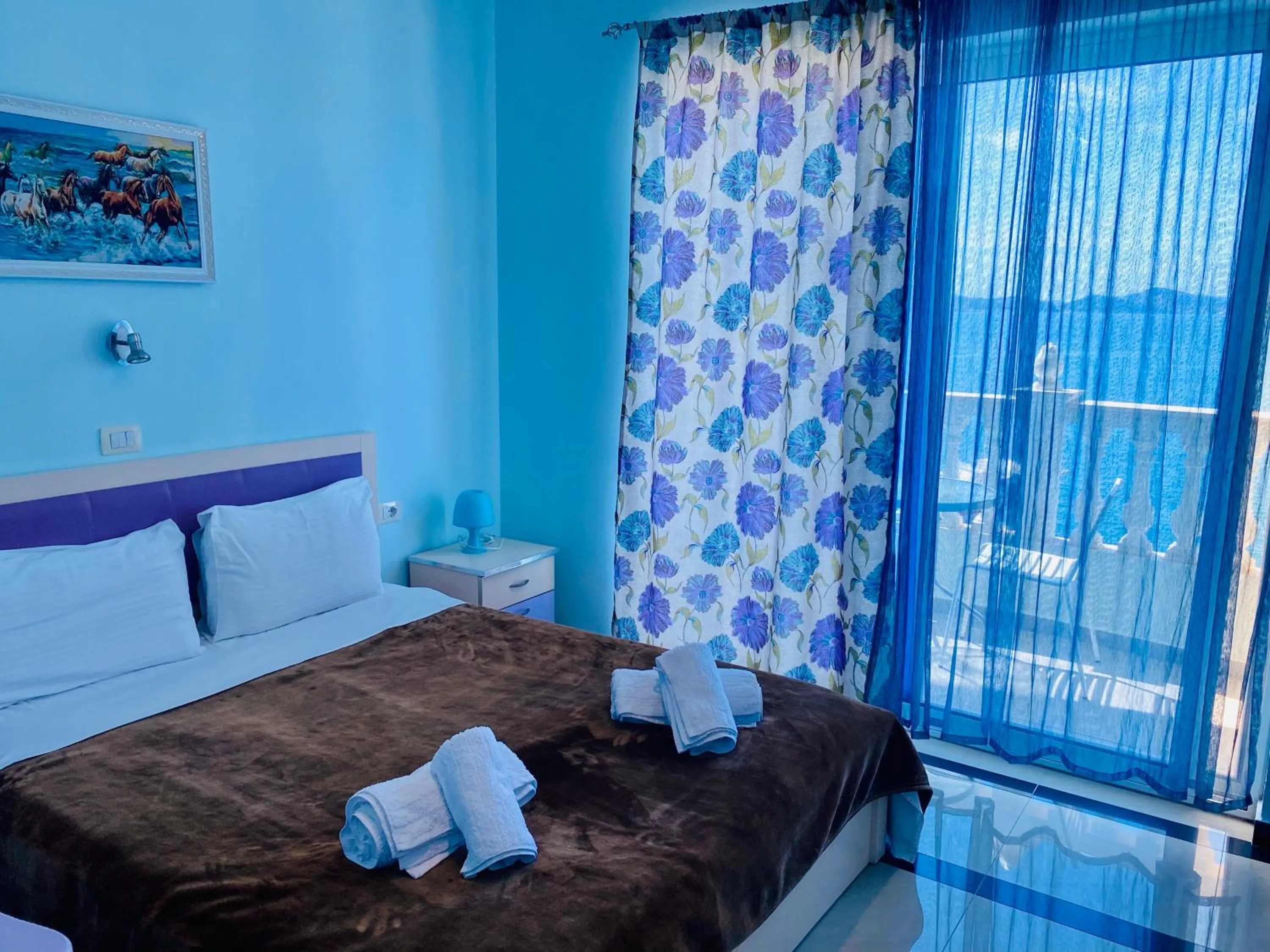 Bed in Kalemi's Beachside Hotel