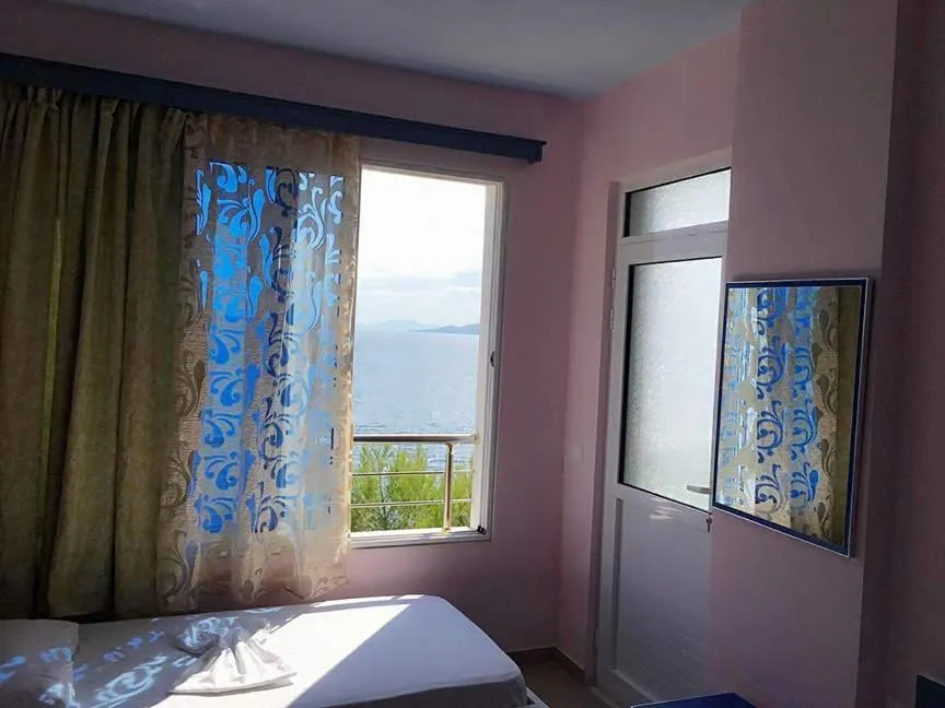 Bed in Kalemi's Beachside Hotel