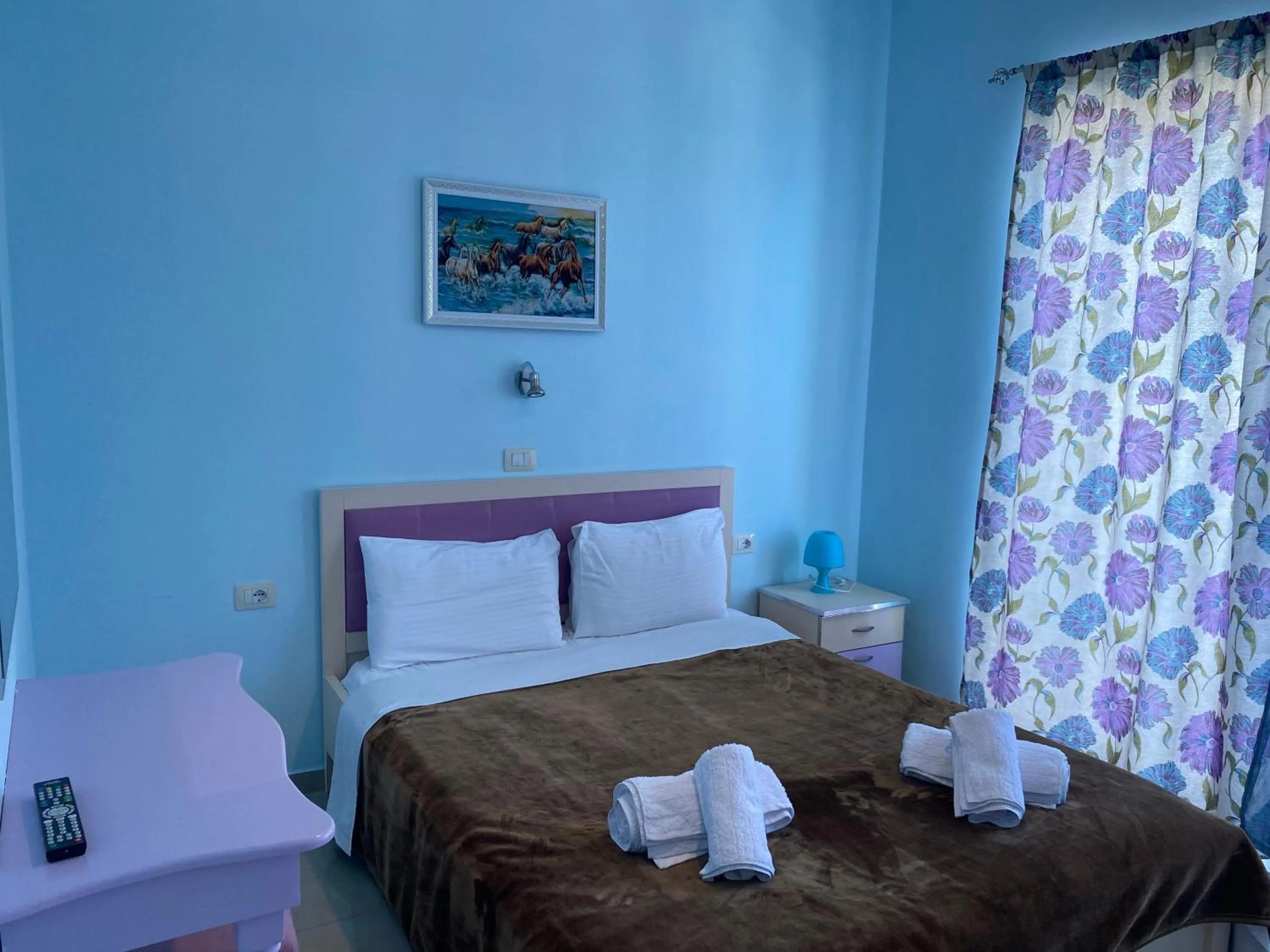 Bed in Kalemi's Beachside Hotel