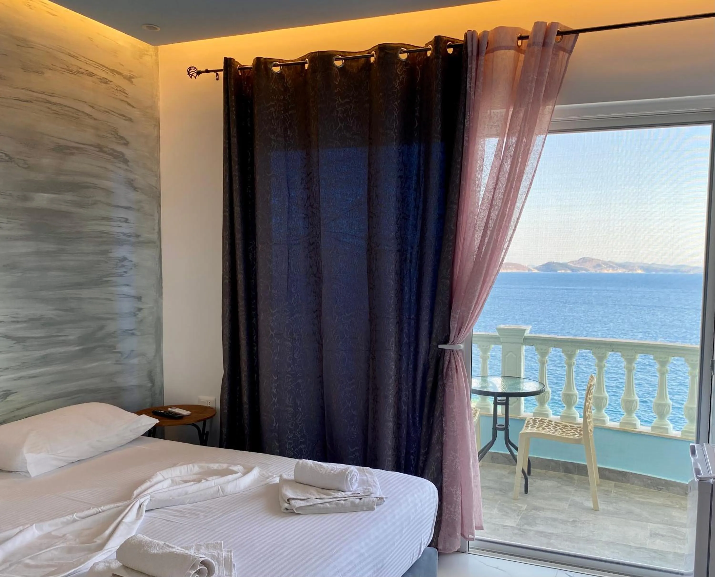 Bed in Kalemi's Beachside Hotel