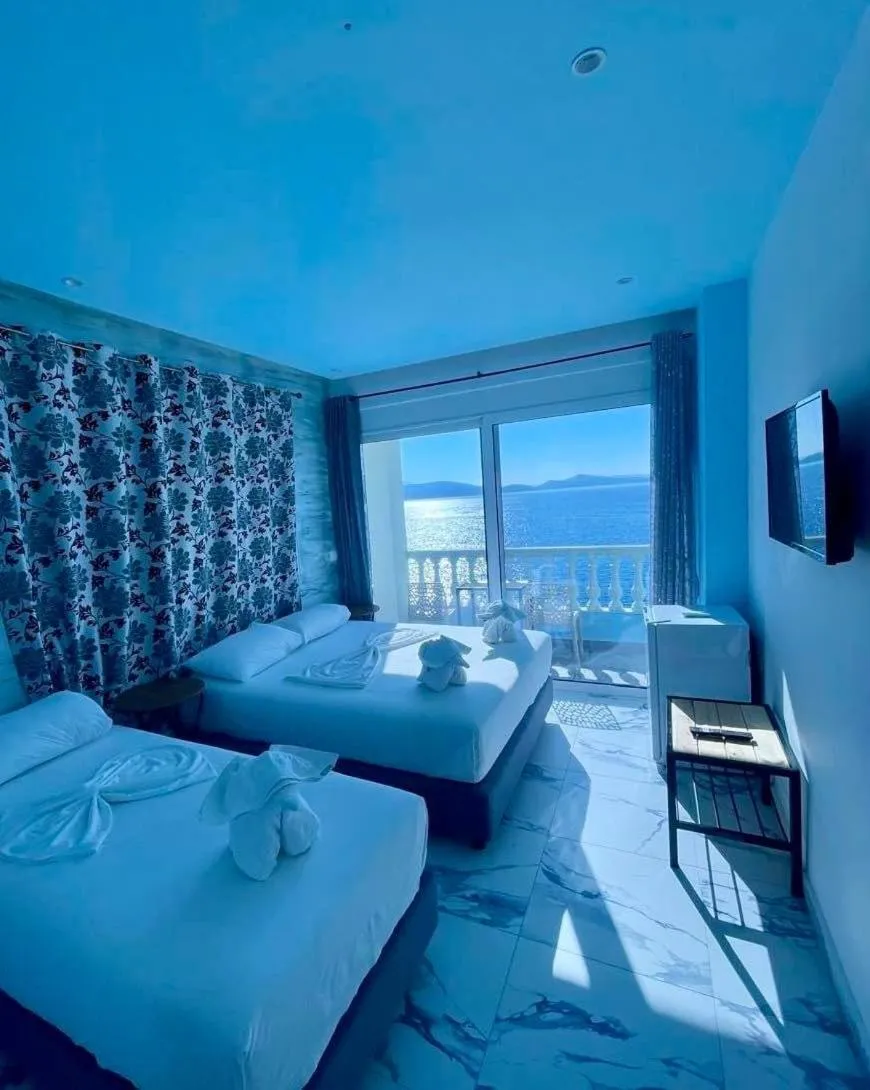 Bed in Kalemi's Beachside Hotel