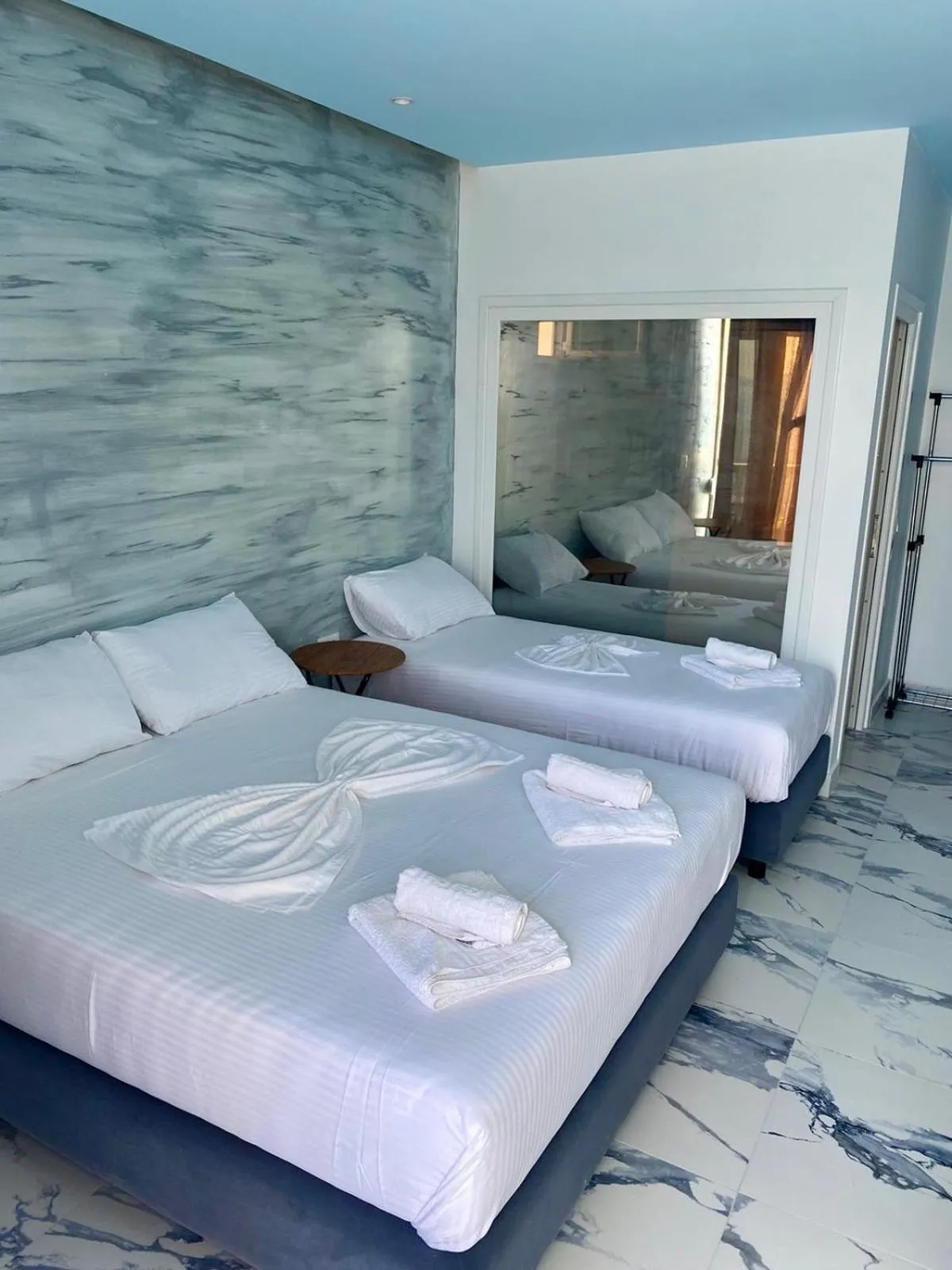 Bed in Kalemi's Beachside Hotel